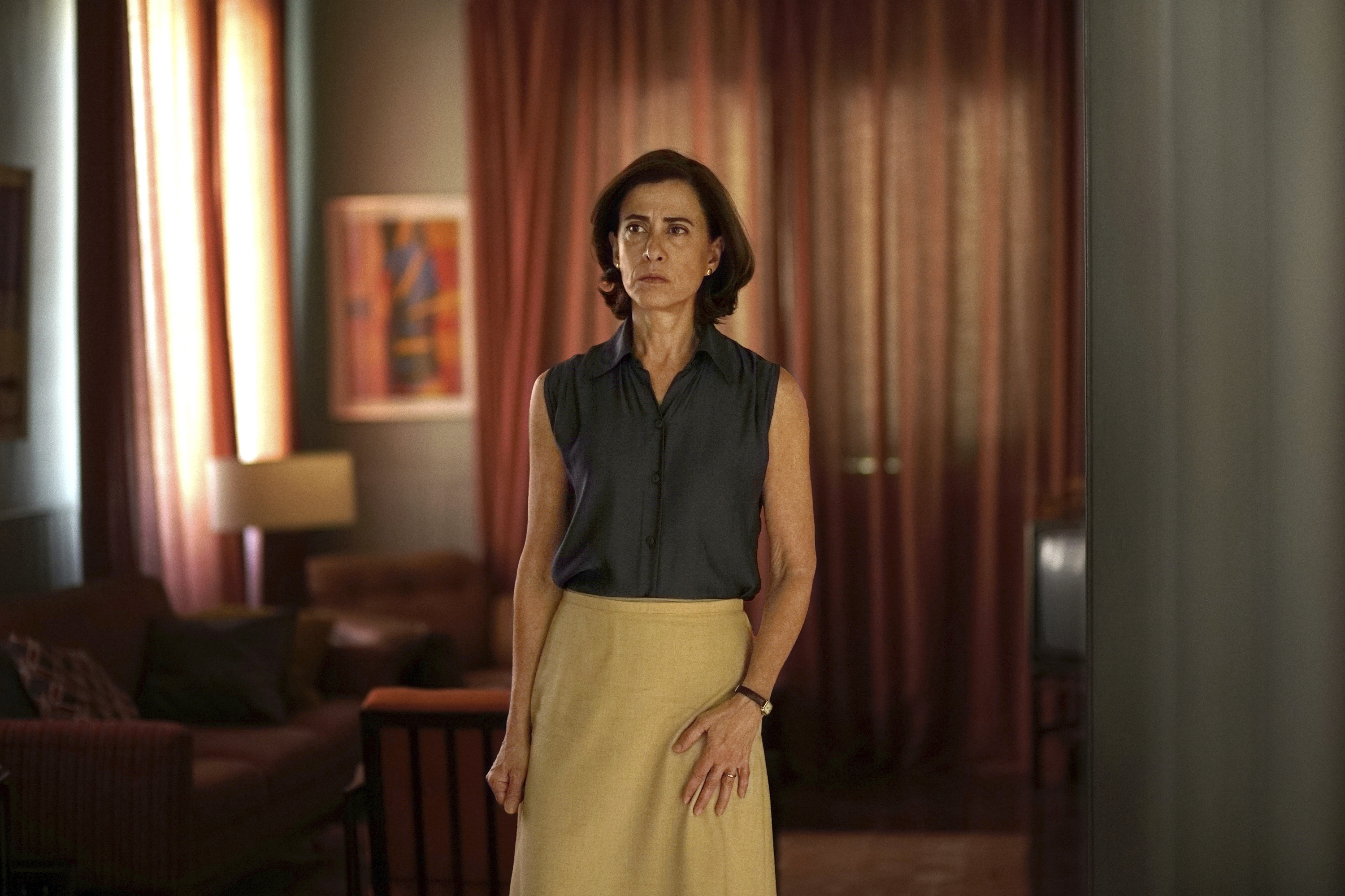 Actor Fernanda Torres walks through a scene in the film I'm Still Here.