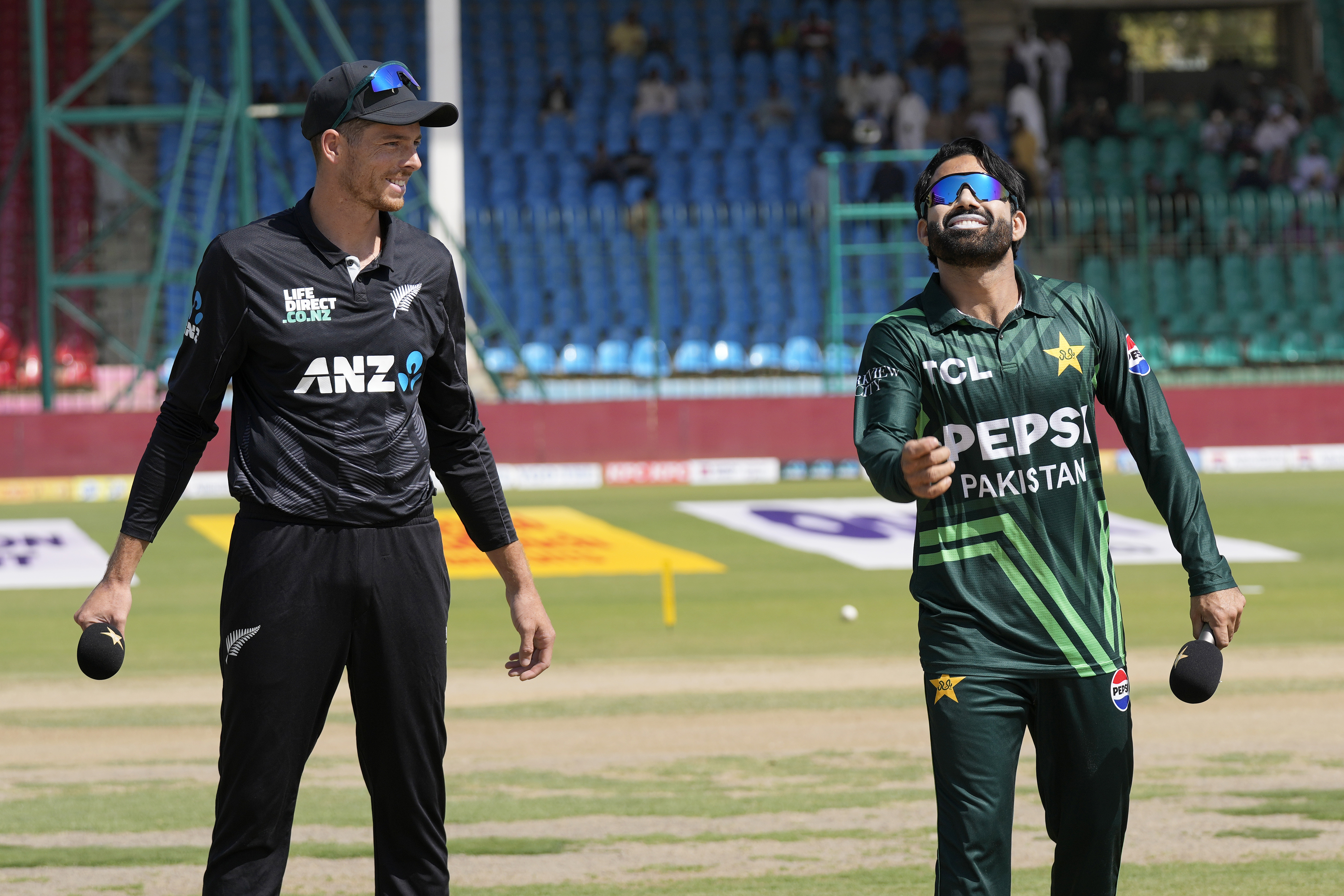 Pakistan's Mohammad Rizwan, right, flips the coin for toss as New Zealand's Mitchel Santner watches before start of the tri-series ODI cricket final match between Pakistan and New Zealand, in Karachi, Pakistan, Friday, Feb. 14, 2025. (AP Photo/Fareed Khan)