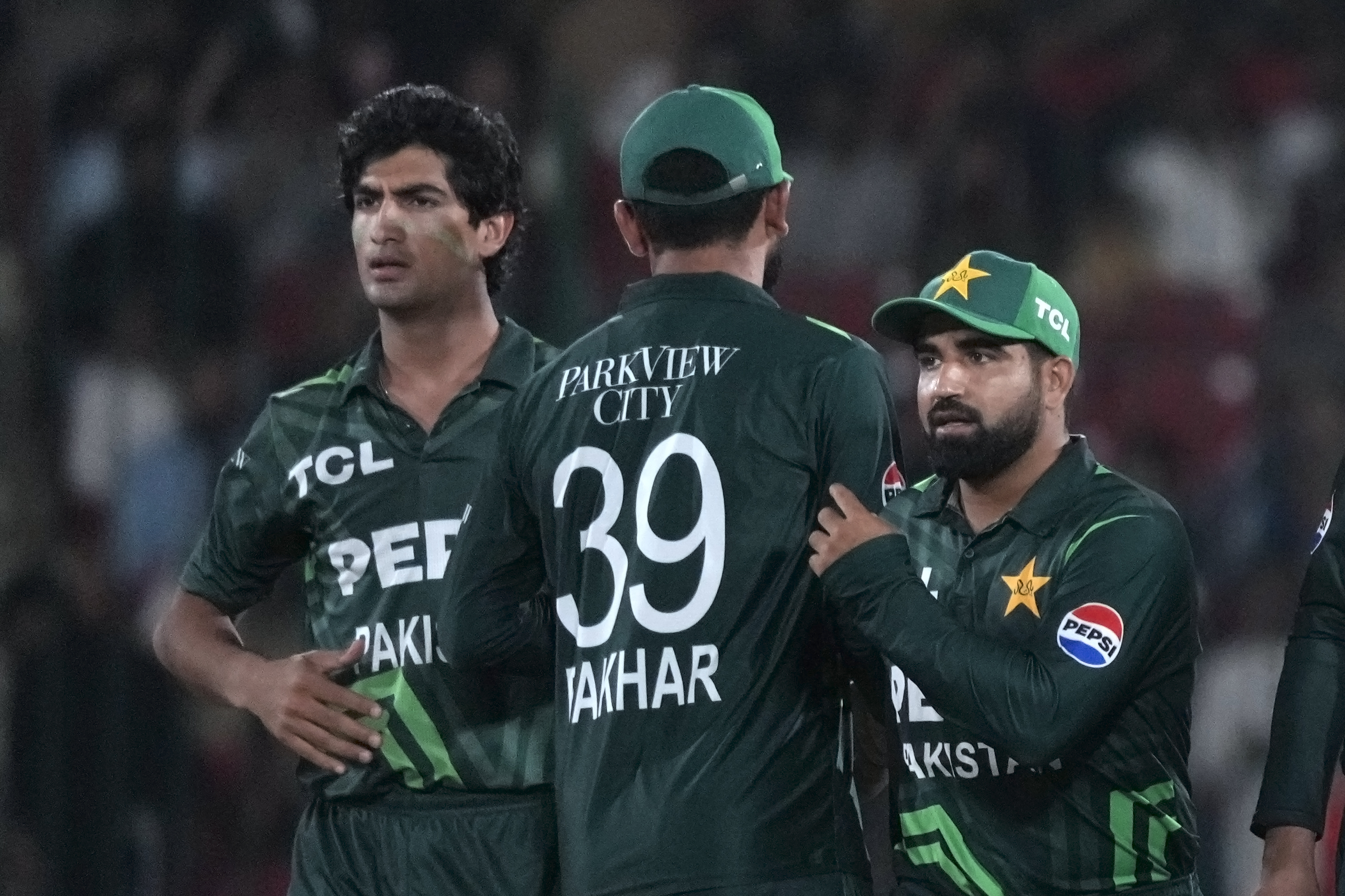 Pakistan's Naseem Shah, left, celebrates with teammates after taking the wicket of New Zealand's Devon Conway during the tri-series ODI cricket final match between Pakistan and New Zealand, in Karachi, Pakistan, Friday, Feb. 14, 2025. (AP Photo/Fareed Khan)