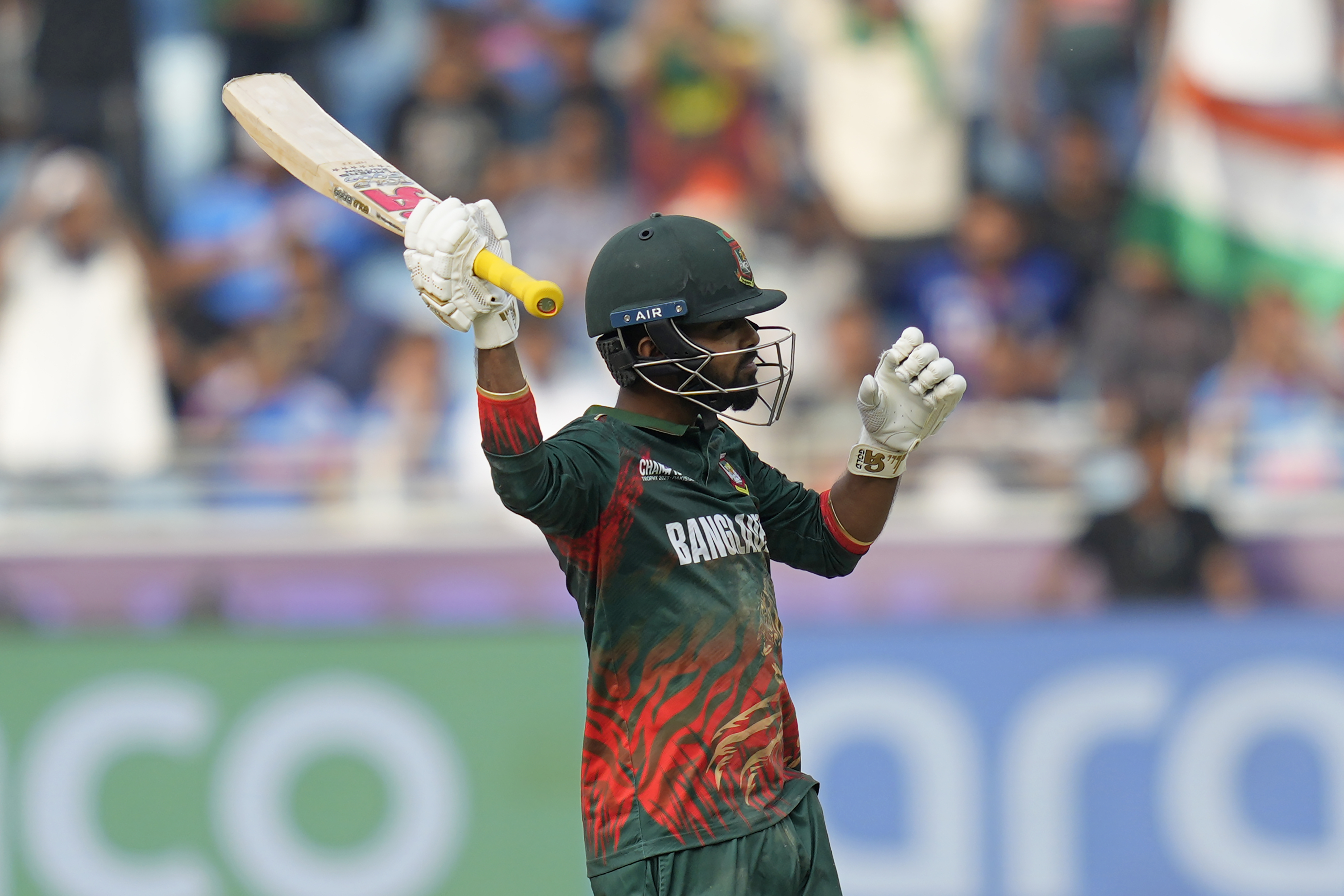 Bangladesh's Towhid Hridoy celebrates after scoring a century during the ICC Champions Trophy cricket match between India and Bangladesh at Dubai International Cricket Stadium in Dubai, United Arab Emirates, Thursday, Feb. 20, 2025. (AP Photo/Altaf Qadri)