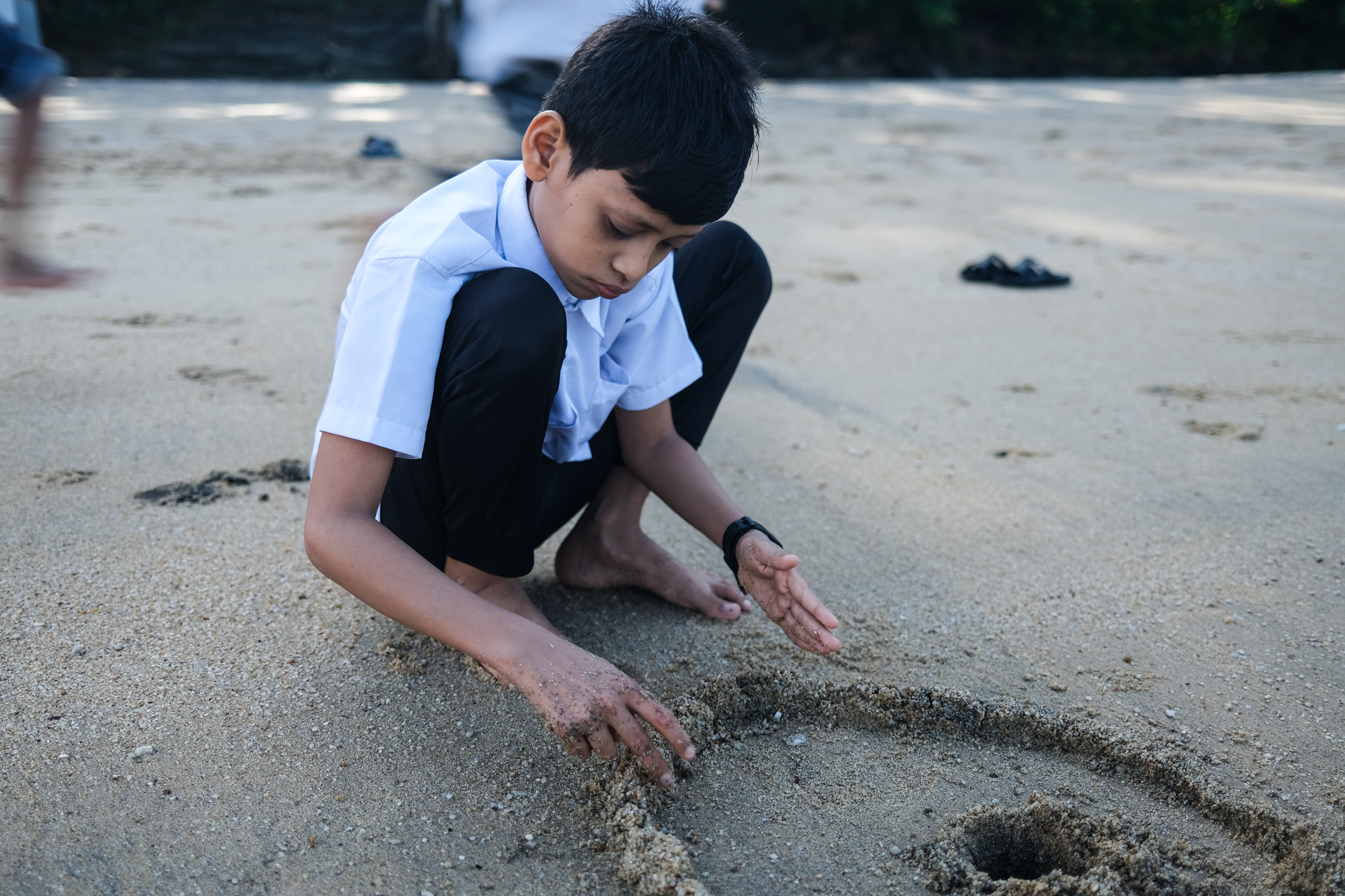 Rohingya children in Malaysia overcome fear to enjoy a day at the beach