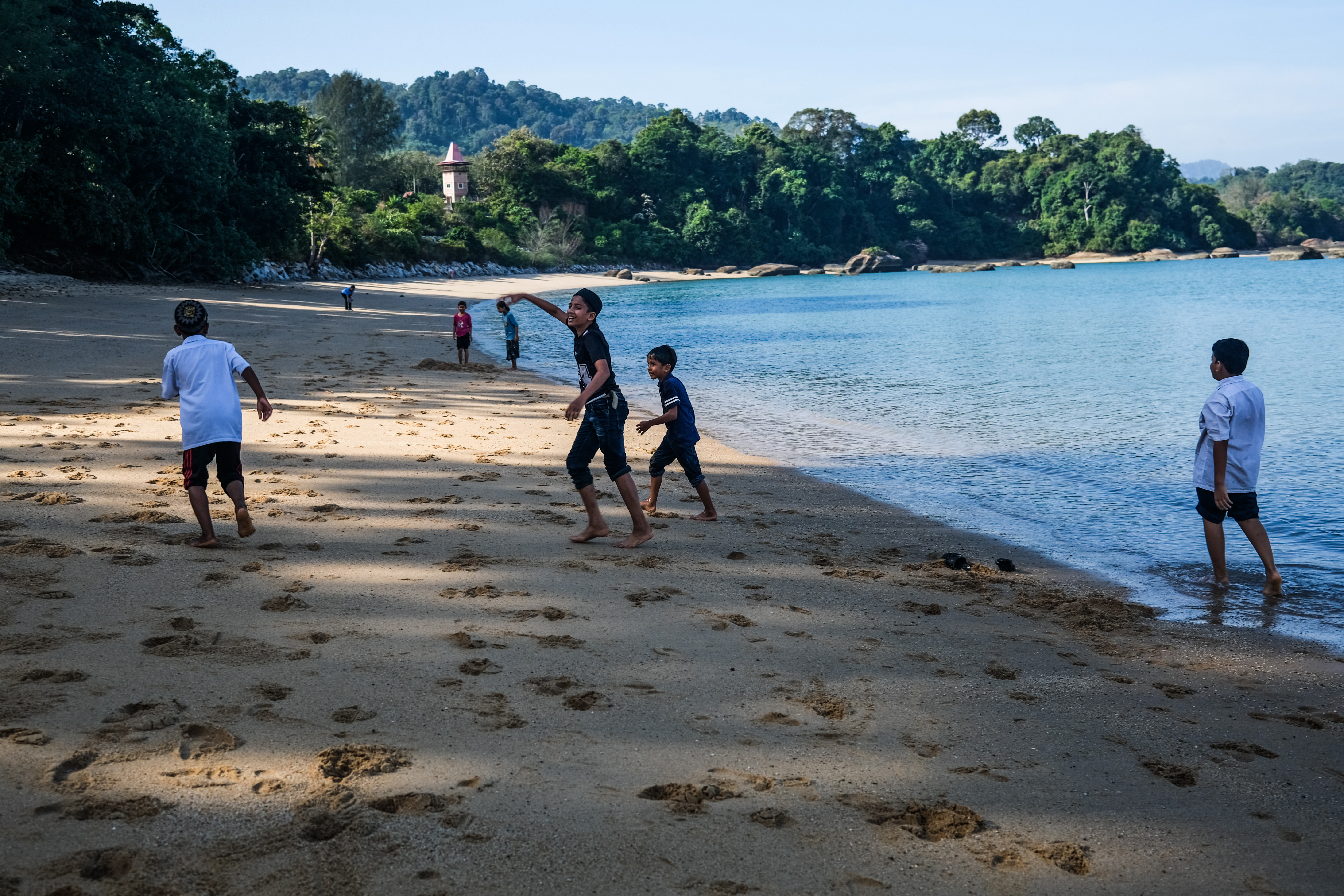 Rohingya children in Malaysia overcome fear to enjoy a day at the beach