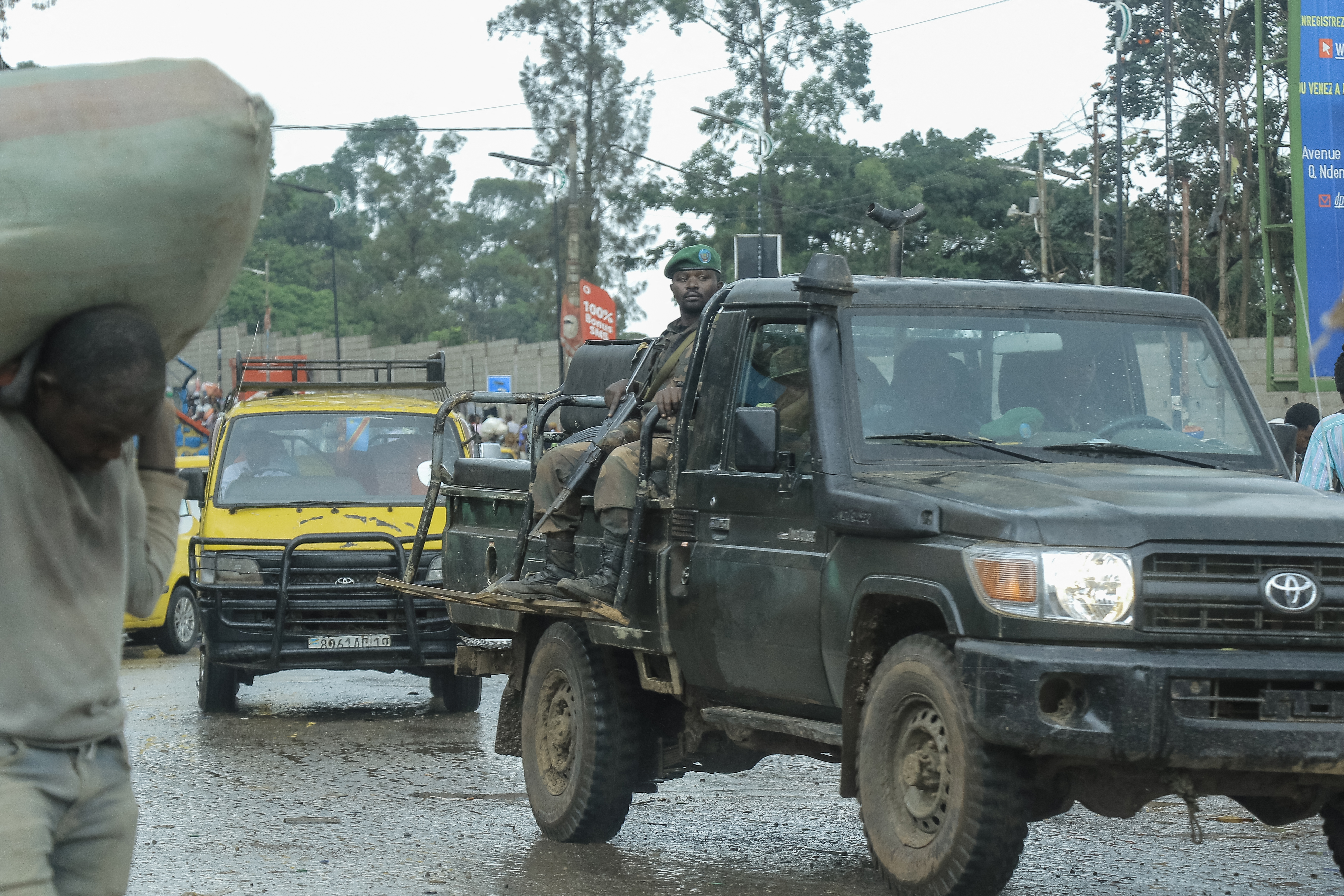 A DRC soldier sits on the back of a pick-up truck in Bukavu.