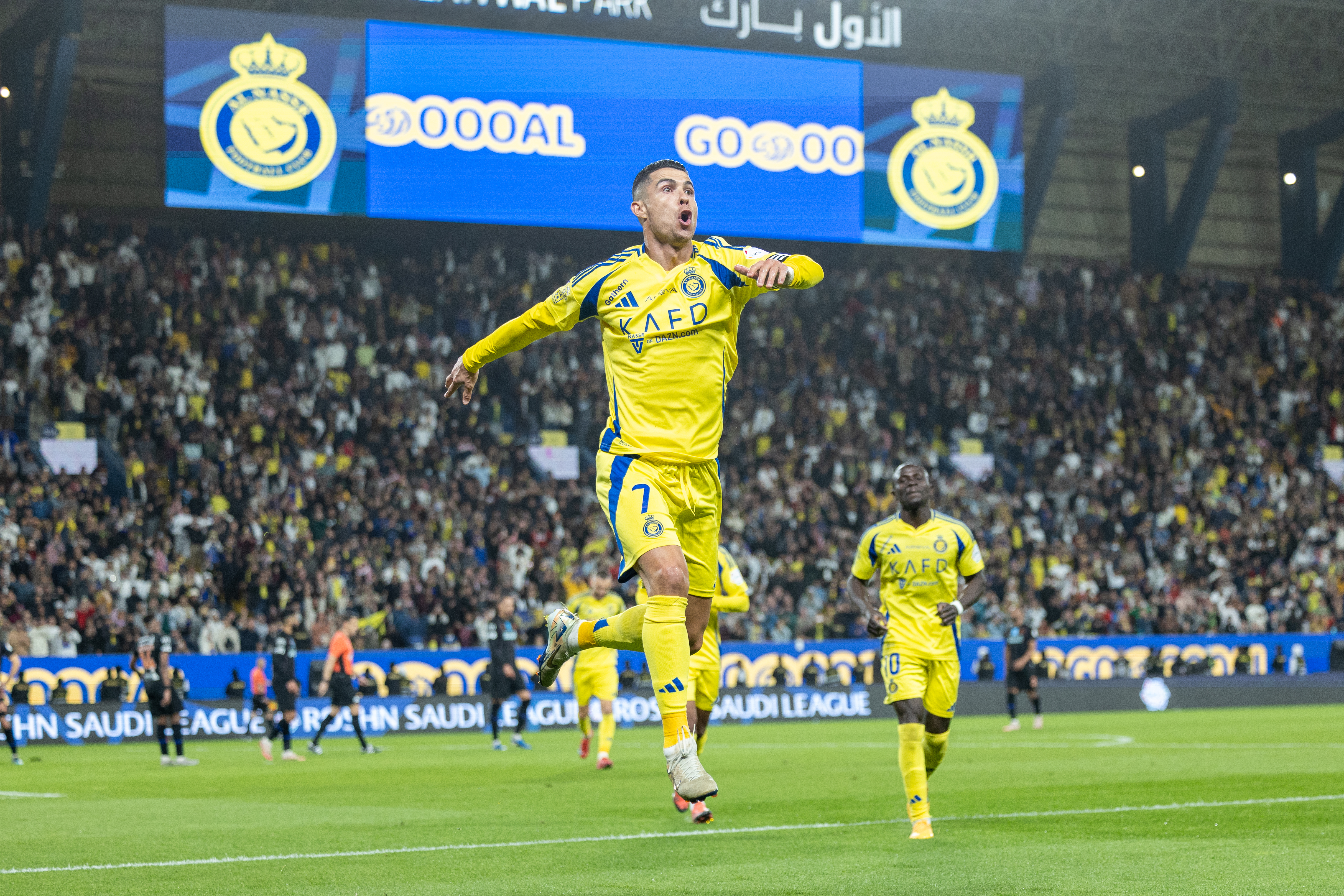 RIYADH, SAUDI ARABIA - FEBRUARY 7: Cristiano Ronaldo of Al-Nassr FC celebrates scoring their third goal during the Saudi Pro League match between Al-Nassr and Al-Fayha at Al Awwal Park on February 7, 2025 in Riyadh, Saudi Arabia. (Photo by Abdullah Ahmed/Getty Images)