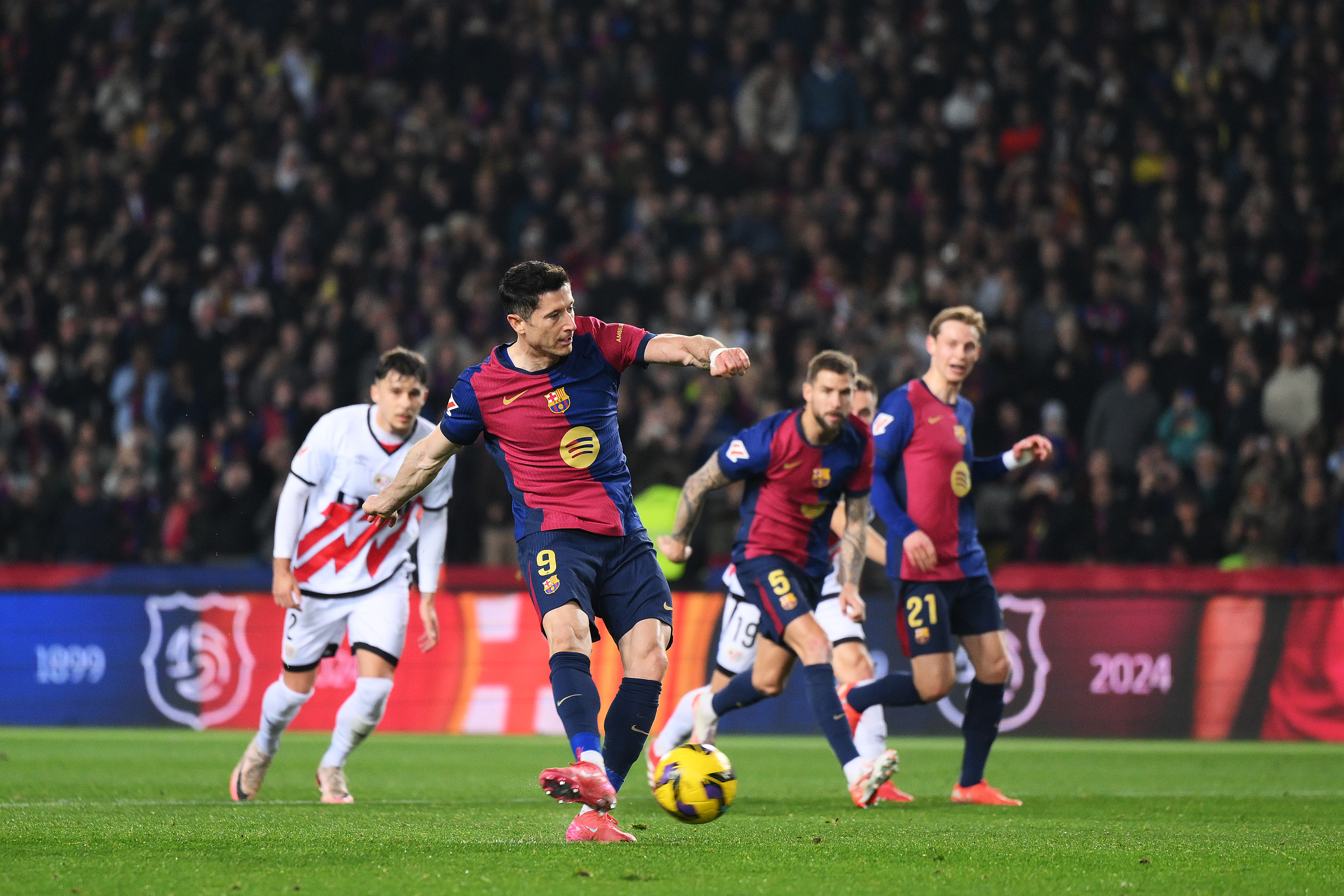 BARCELONA, SPAIN - FEBRUARY 17: Robert Lewandowski of FC Barcelona scores his team's first goal from the penalty spot during the LaLiga match between FC Barcelona and Rayo Vallecano at Estadi Olimpic Lluis Companys on February 17, 2025 in Barcelona, Spain. (Photo by David Ramos/Getty Images)