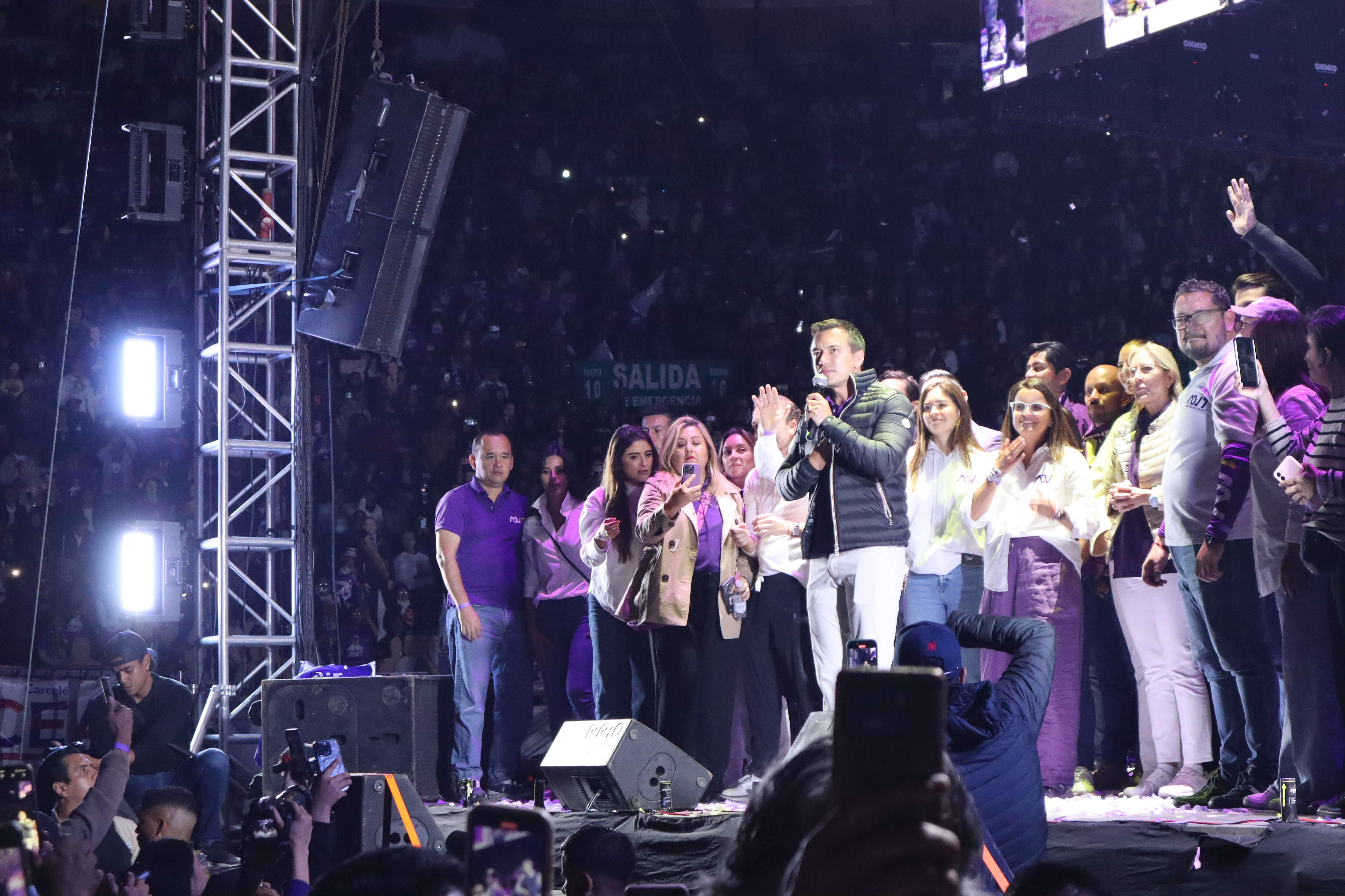 Daniel Noboa speaks on a crowded stage in Quito