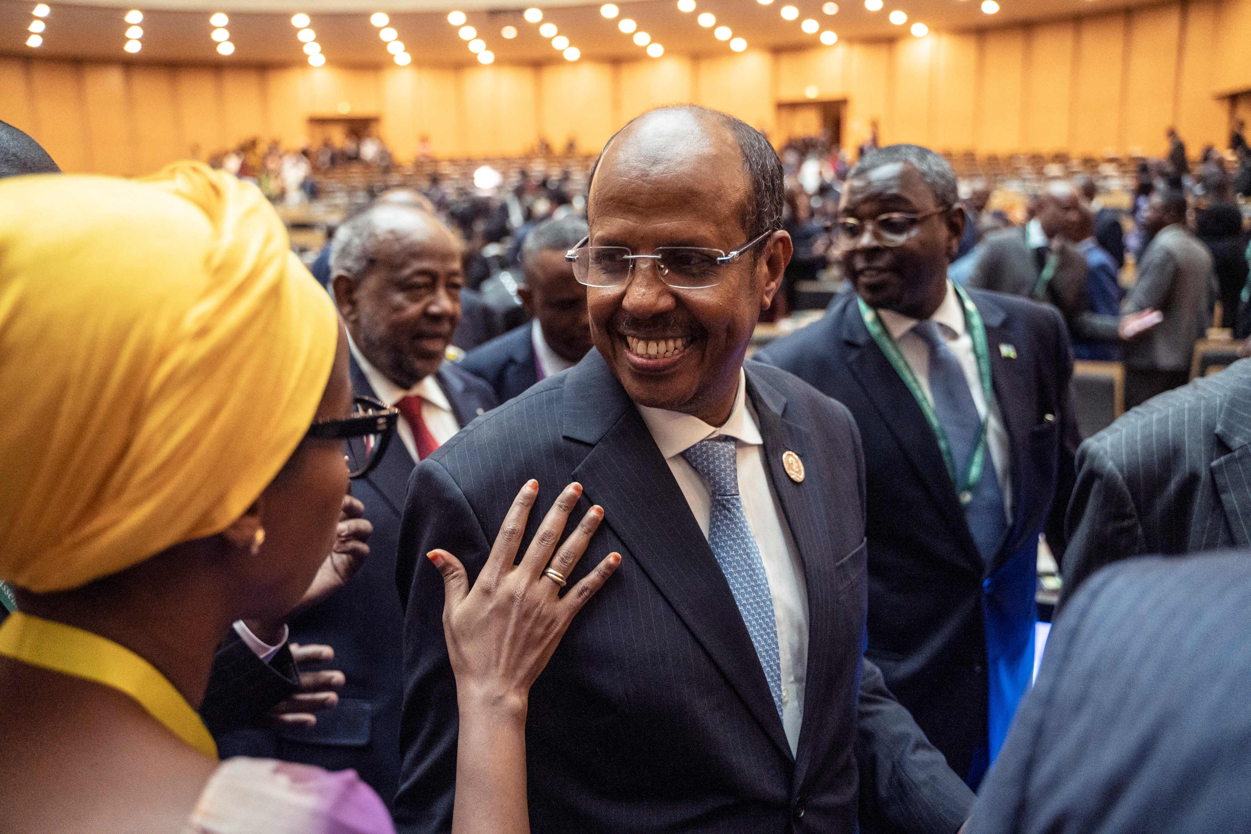 Mahmoud Ali Youssouf (C) smiles after election results.
