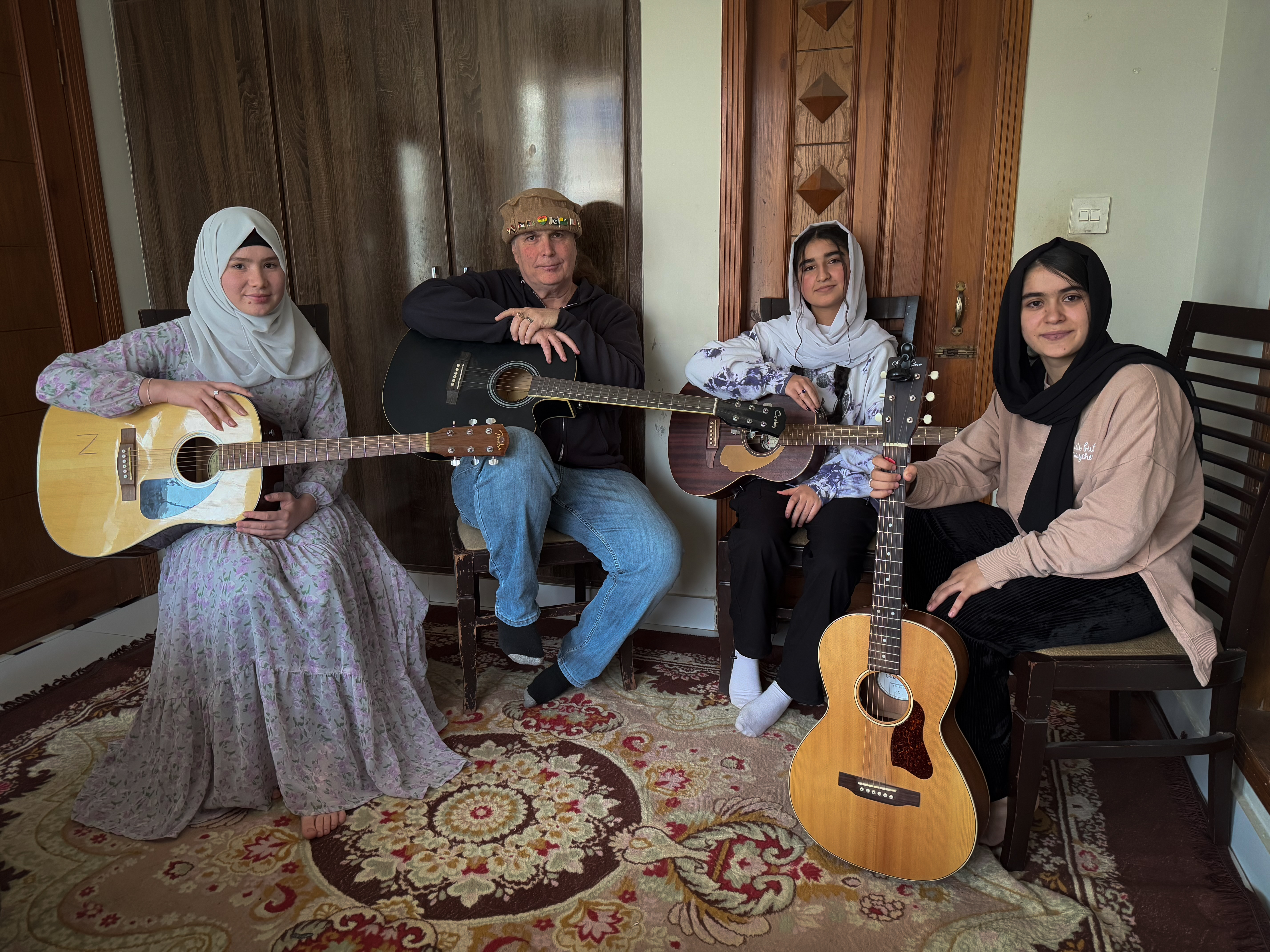 Zakia (left), American musician Lanny Cordola, Shukriya and Jellybean pose for a photograph.