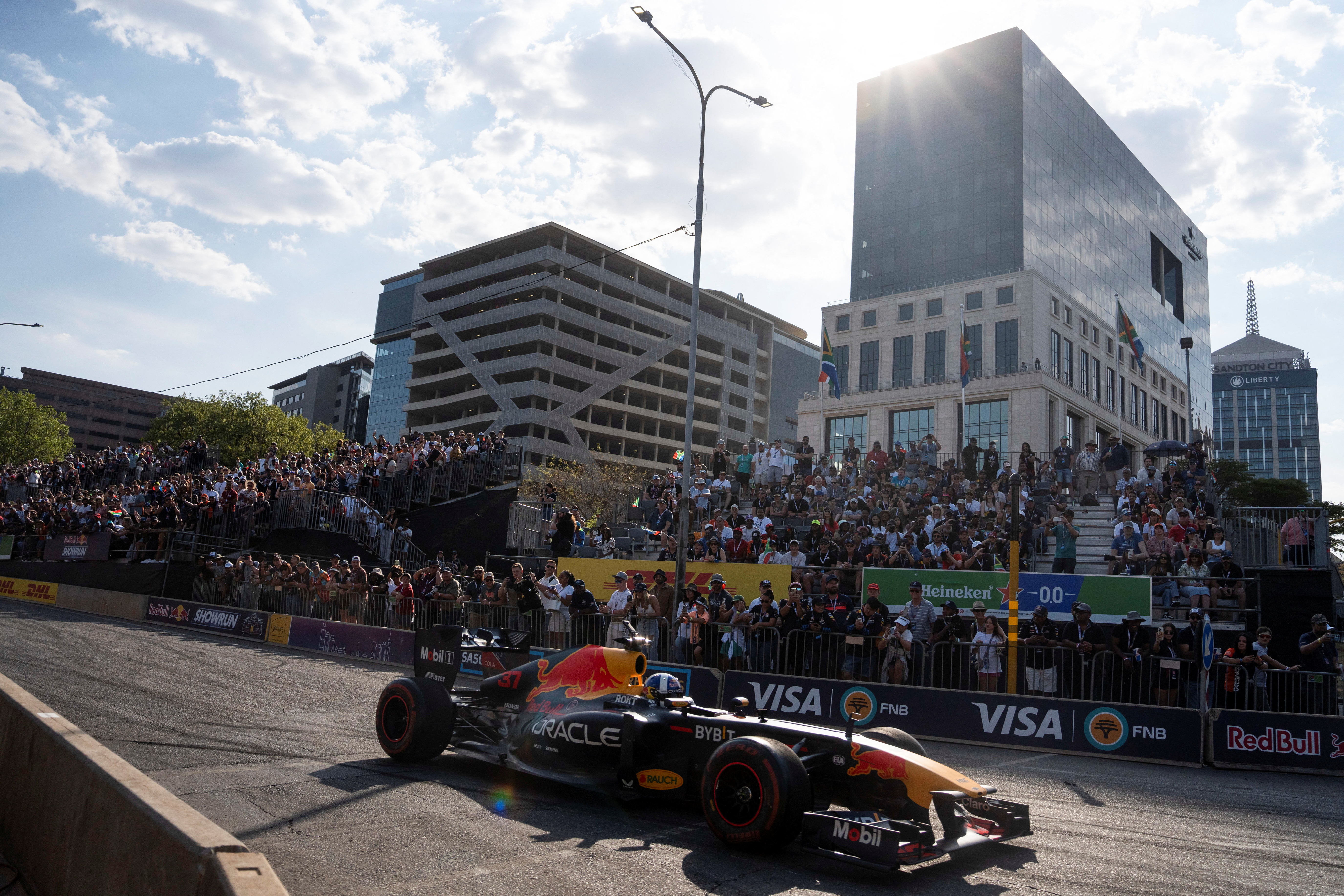David Coulthard, a former Formula 1 driver, drives the Red Bull RB7 through the streets of the Sandton CBD as part of the Red Bull Showrun in Johannesburg, South Africa, October 6, 2024. REUTERS/Ihsaan Haffejee