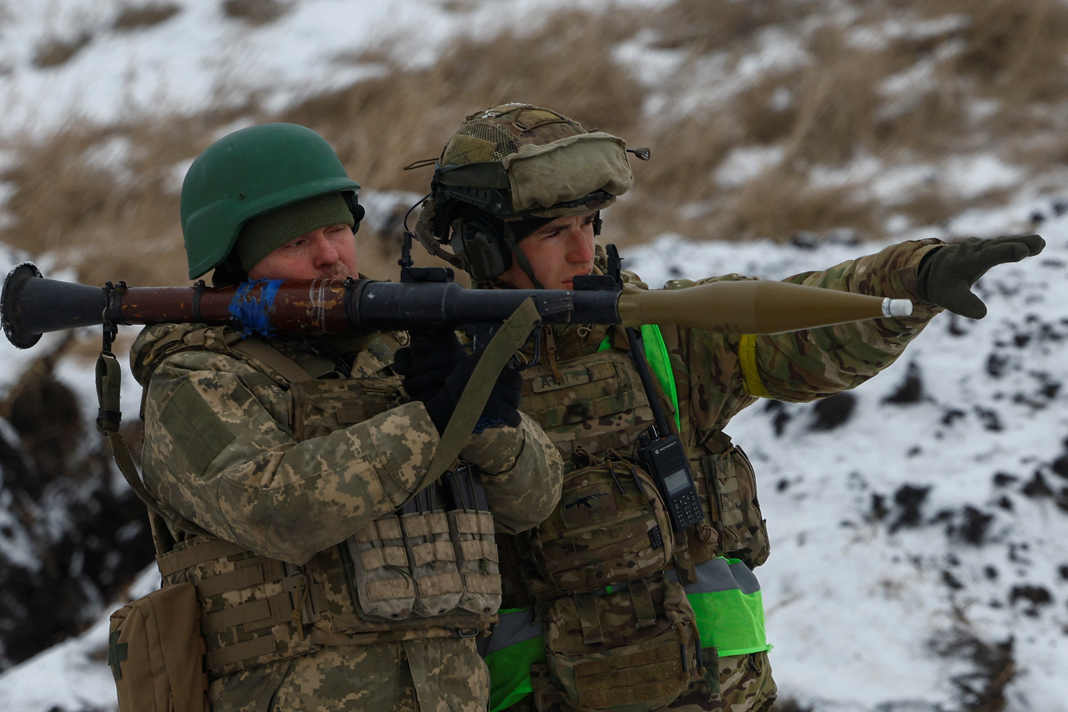 Ukrainian servicemen use an RPG-7 grenade launcher.