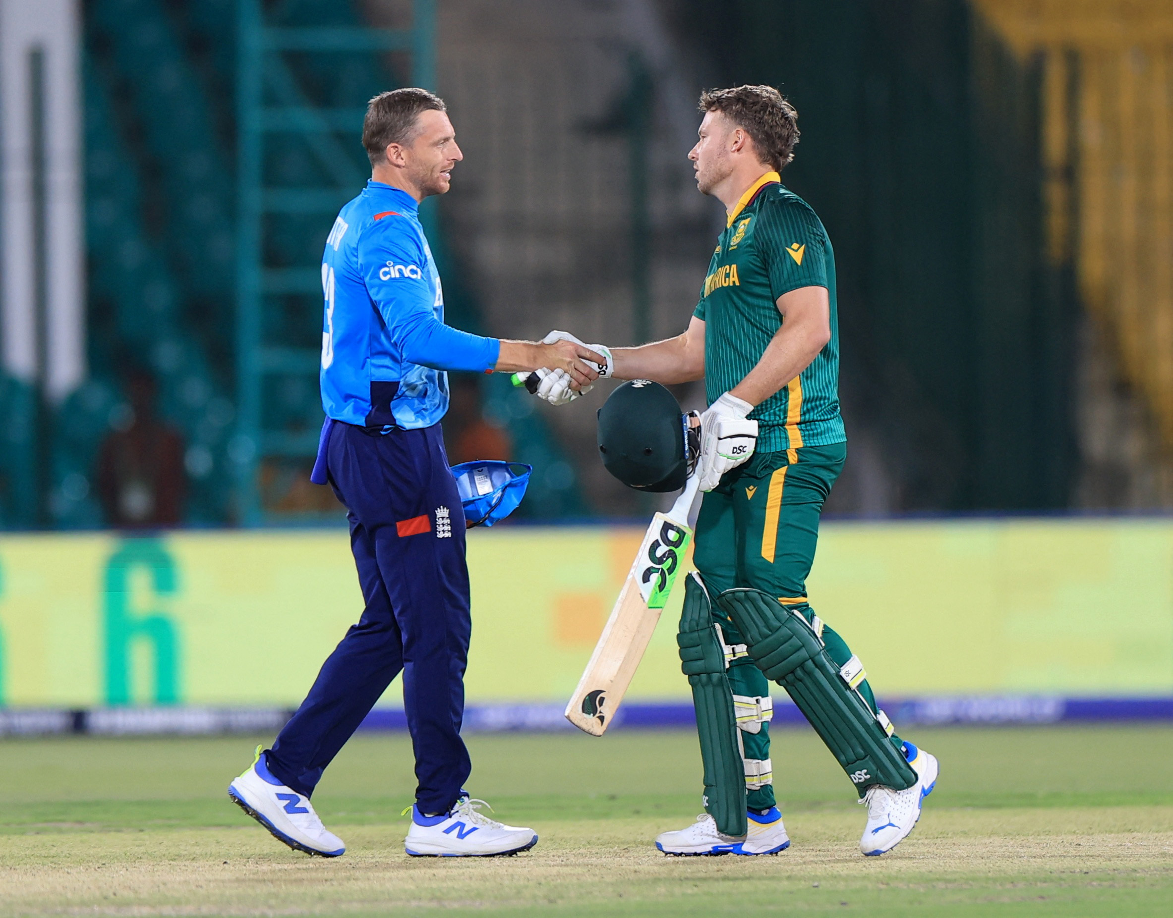 Cricket - ICC Men's Champions Trophy - Group B - England v South Africa - National Stadium, Karachi, Pakistan - March 1, 2025 South Africa's David Miller shakes hands with England's Jos Buttler after the match REUTERS/Akhtar Soomro