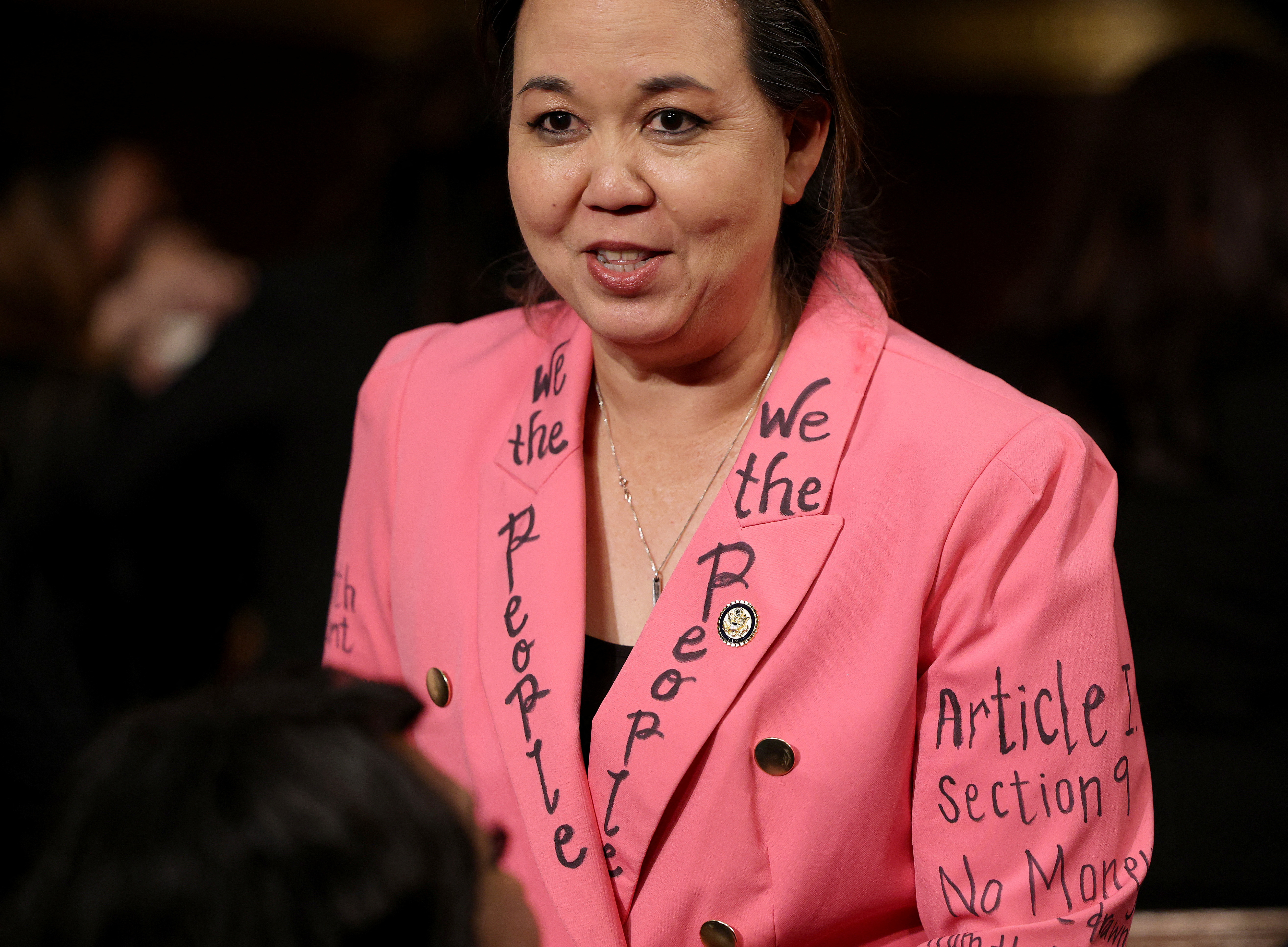 A Democratic congresswoman wears a jacket with lines from the US Constitution