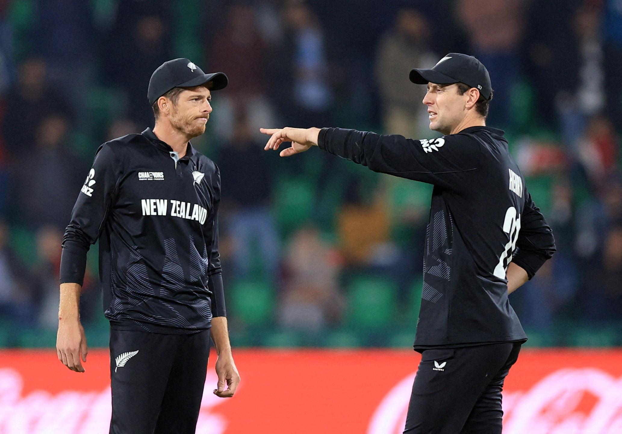 FILE PHOTO: Cricket - ICC Men's Champions Trophy - Semi Final - South Africa v New Zealand - Gaddafi Stadium, Lahore, Pakistan - March 5, 2025 New Zealand's Mitchell Santner interacts with Matt Henry REUTERS/Akhtar Soomro/File Photo