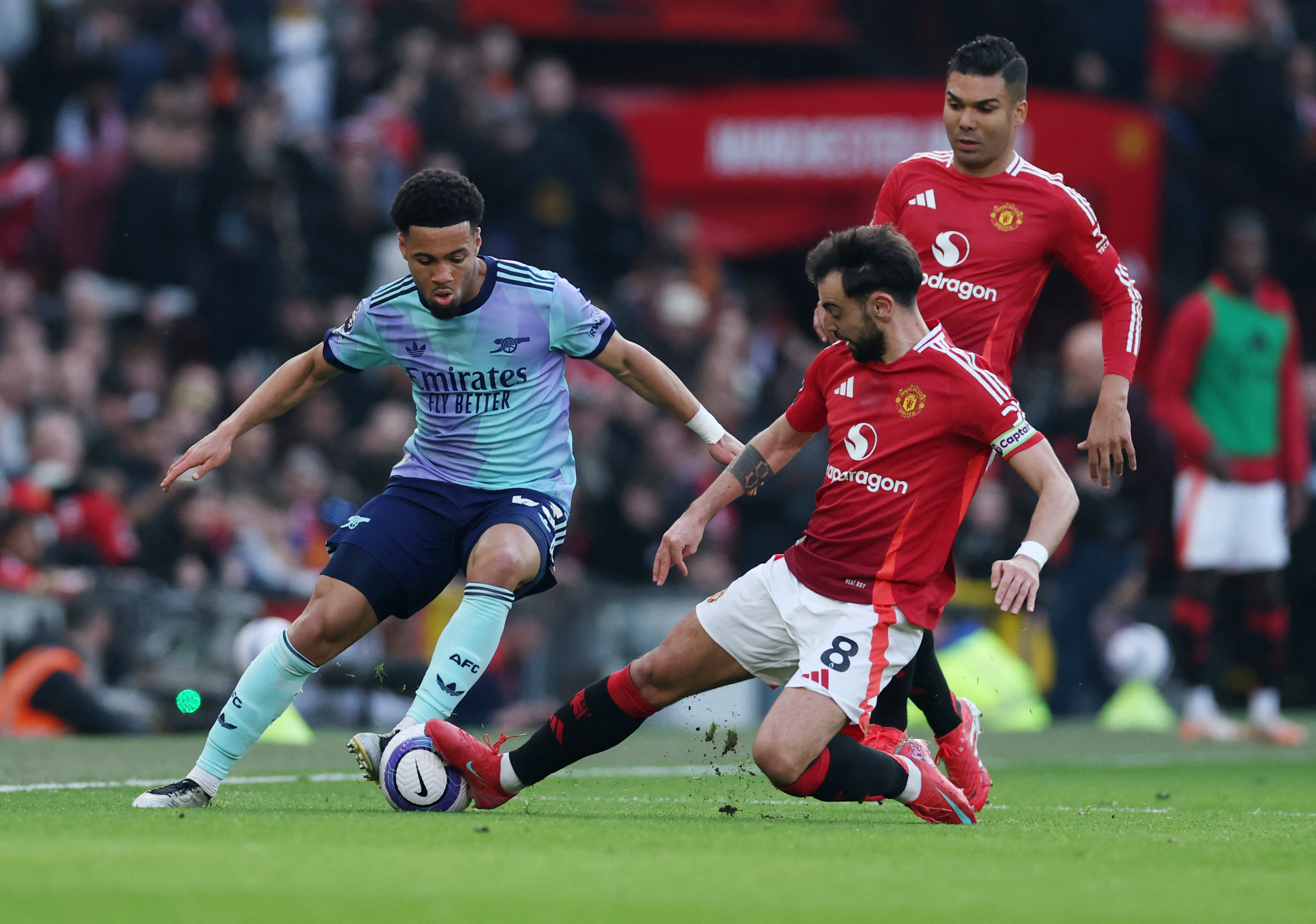 Arsenal's Ethan Nwaneri in action with Manchester United's Bruno Fernandes