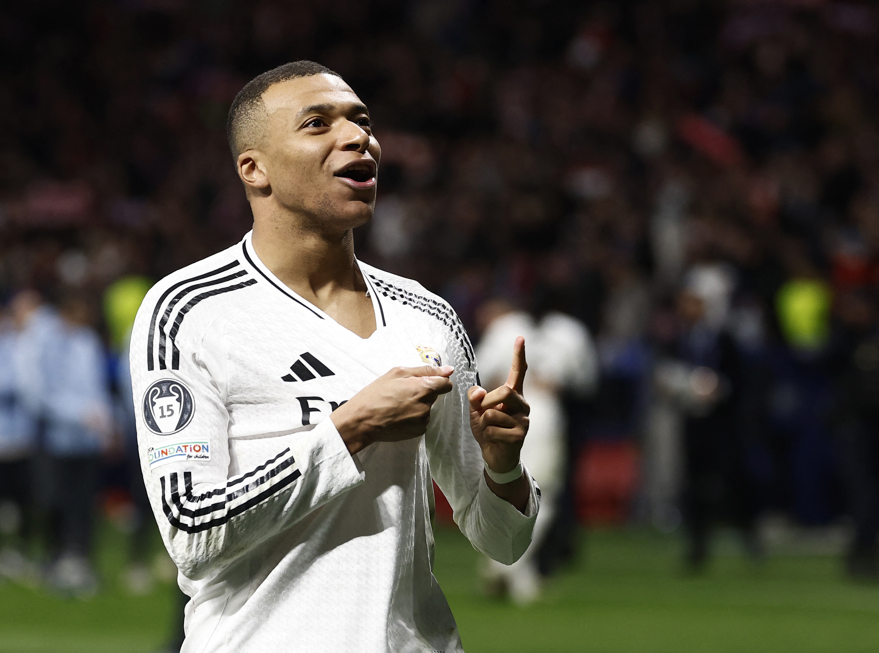 Soccer Football - Champions League - Round of 16 - Second Leg - Atletico Madrid v Real Madrid - Metropolitano, Madrid, Spain - March 12, 2025 Real Madrid's Kylian Mbappe celebrates after the match REUTERS/Juan Medina