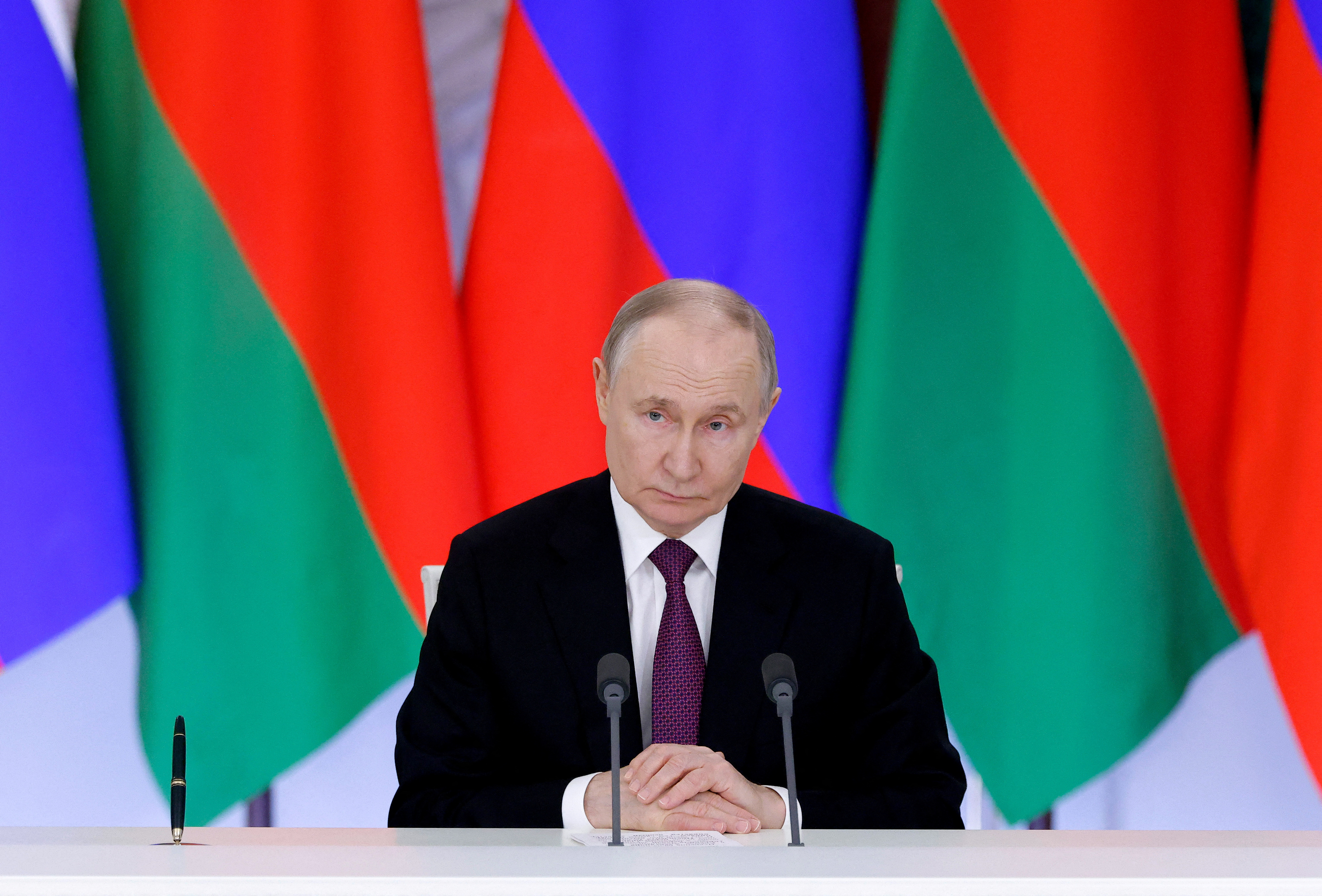 Russia's President Vladimir Putin attends a signing ceremony and a news conference.