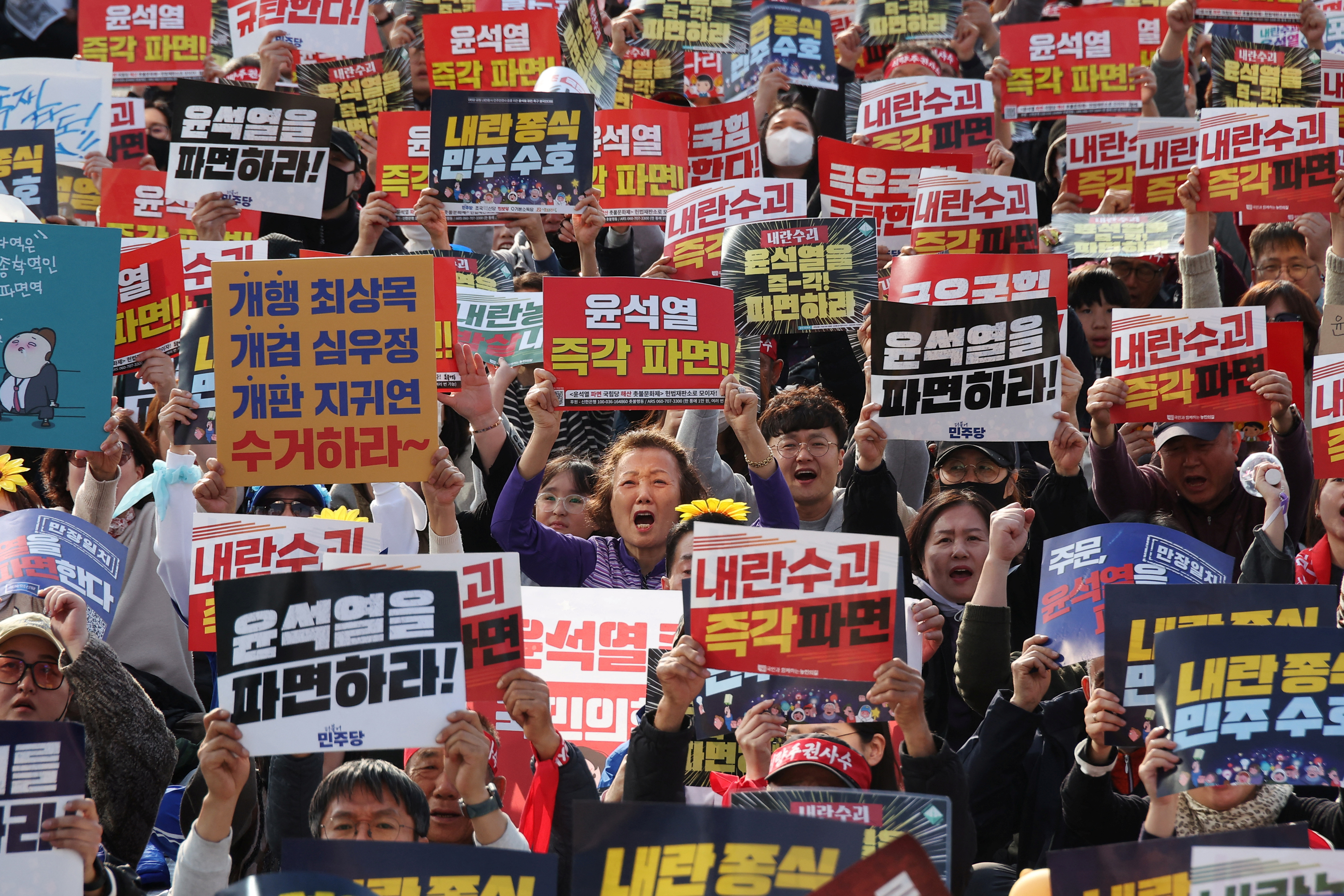 People attend a rally calling for immediate expulsion of impeached South Korean President Yoon Suk Yeol