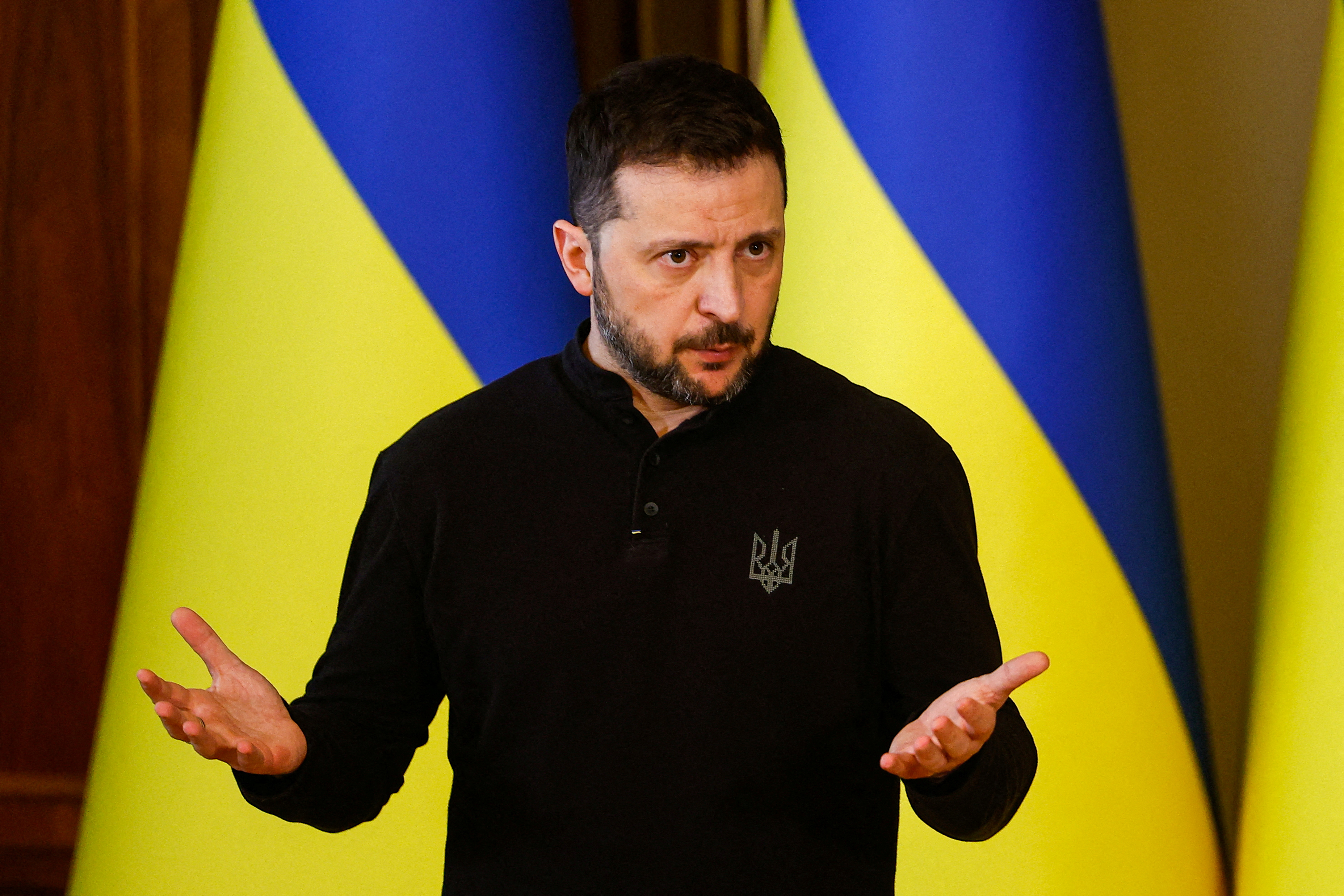 Ukrainian President Volodymyr Zelenskyy gestures as he attends a press conference,