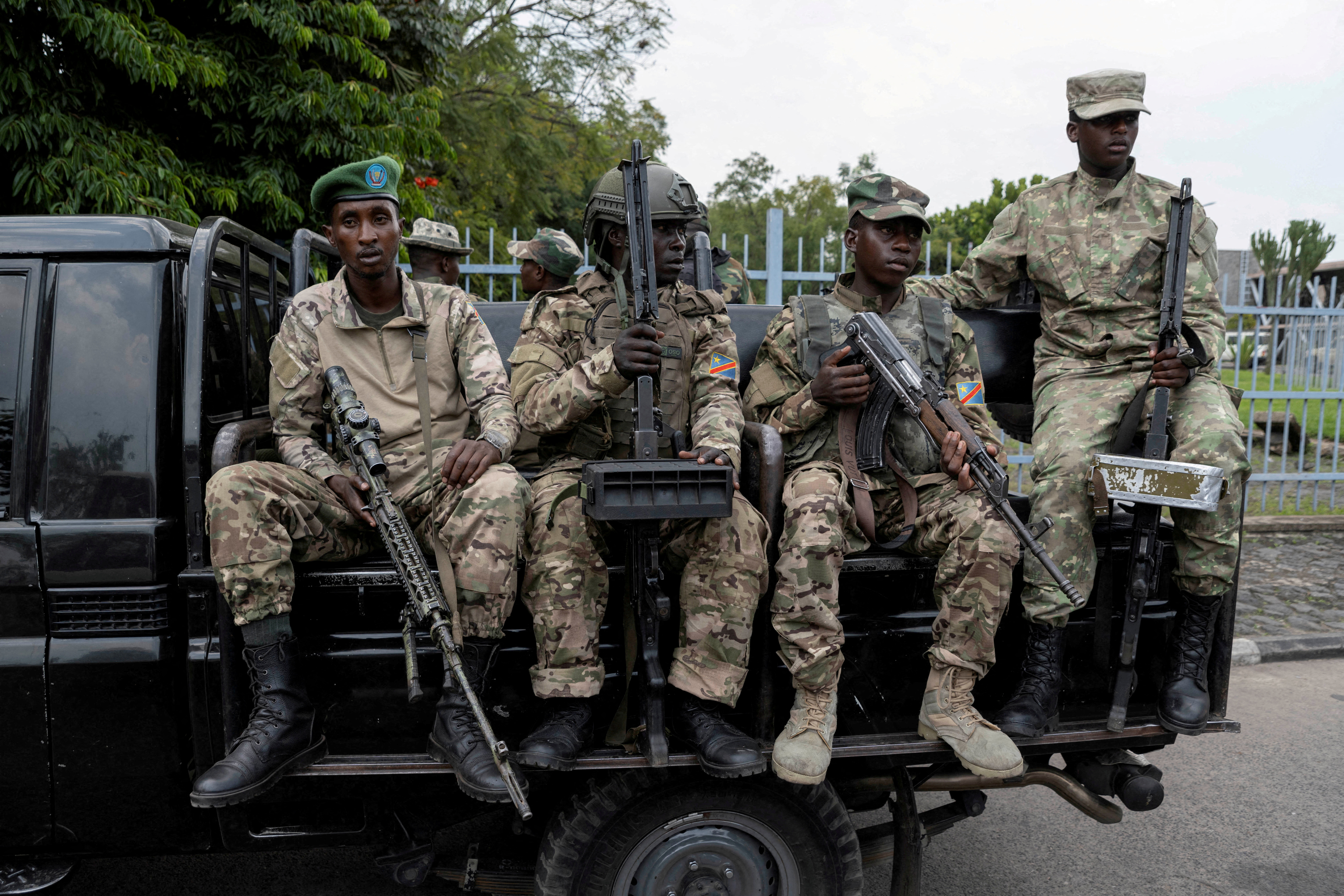 M23 rebels sit on a truck during the escort of captured FDLR members (not pictured) to Rwanda for repatriation, at the Goma-Gisenyi Grande Barrier border crossing, March 1, 2025. REUTERS/Arlette Bashizi//File Photo