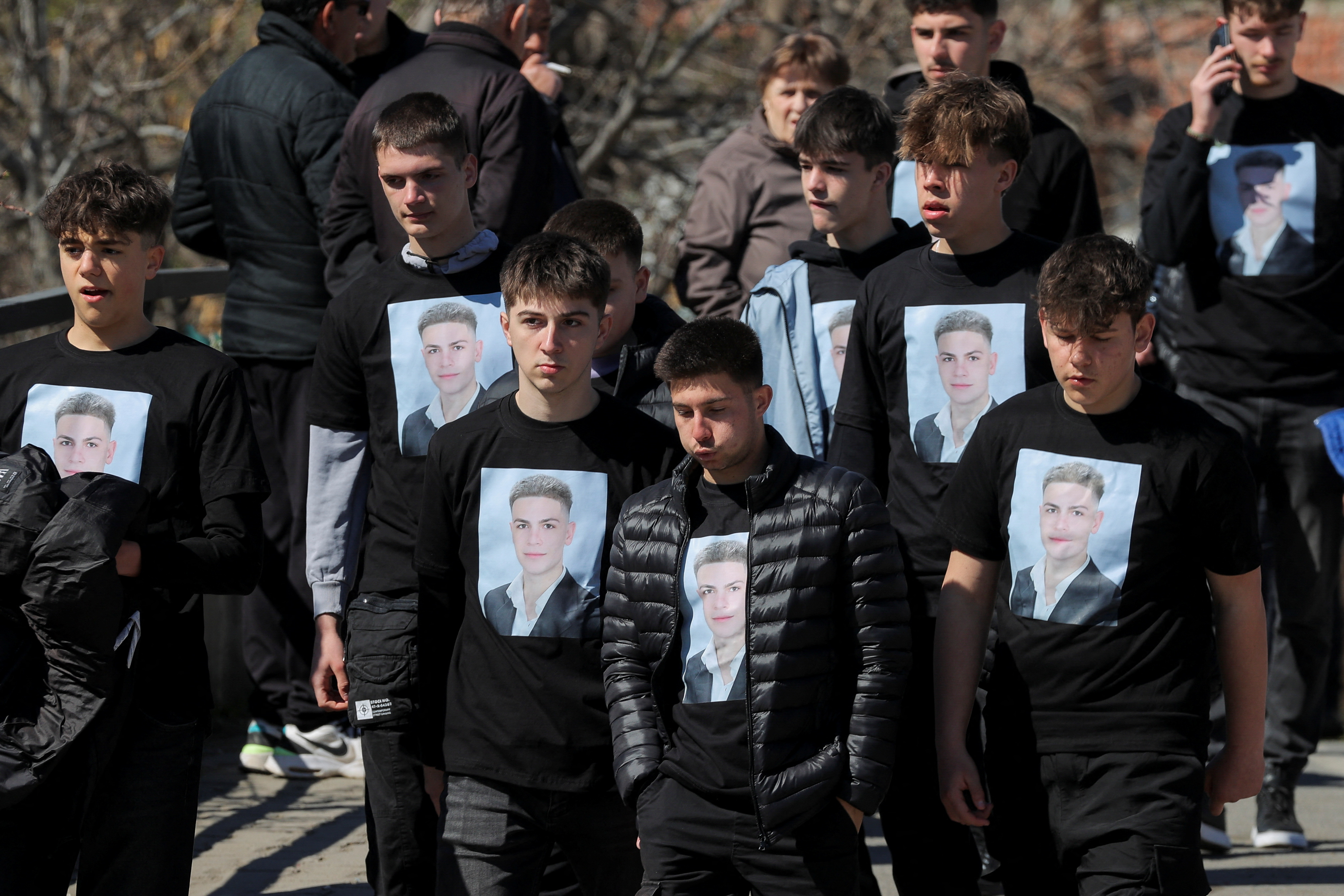 People attend a funeral ceremony for the victims of a fire at the Pulse nightclub, in the town of Kocani, North Macedonia, March 20, 2025. REUTERS/Valdrin Xhemaj