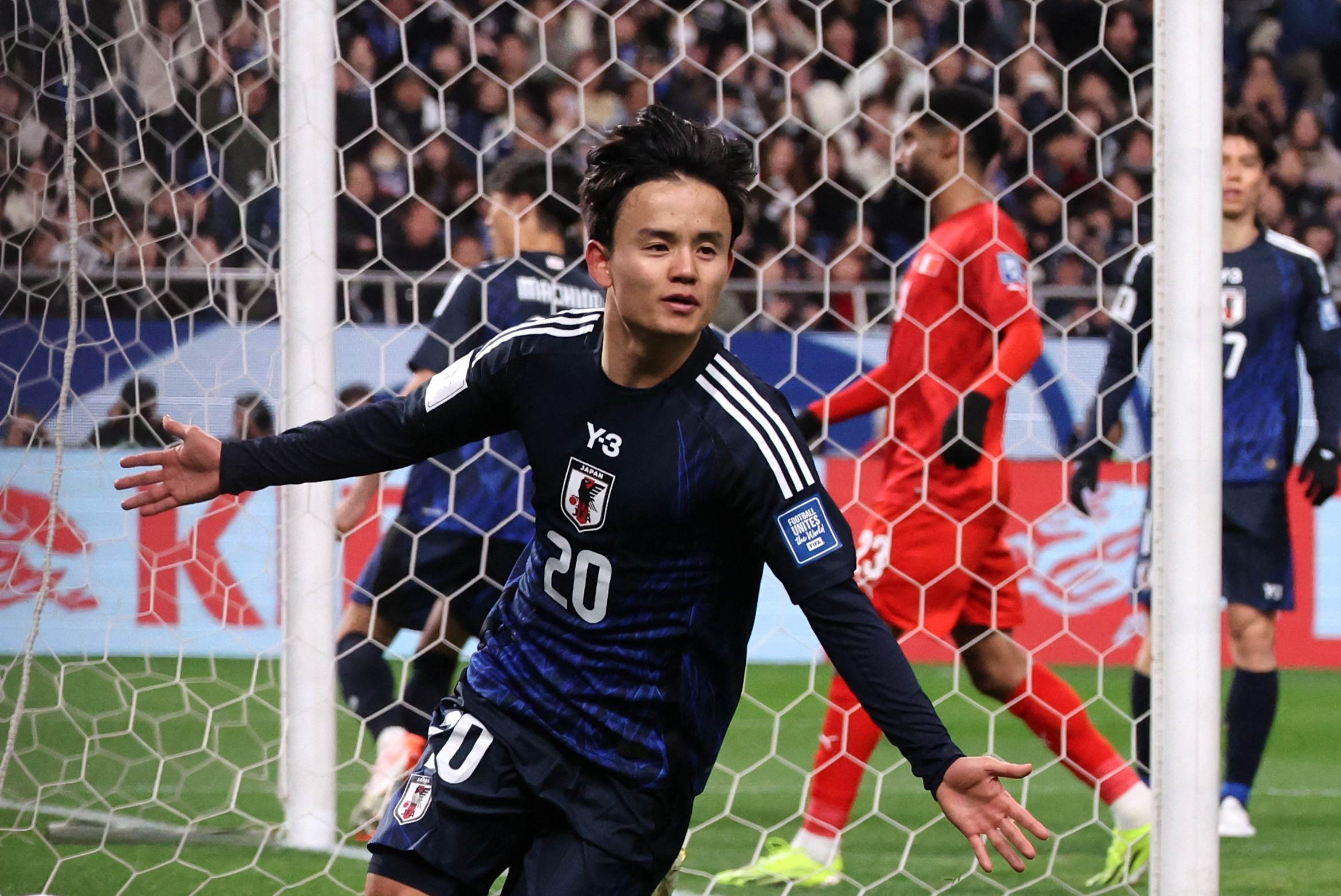 Soccer Football - World Cup - AFC Qualifiers - Third Round - Group C - Japan v Bahrain - Saitama Stadium, Saitama, Japan - March 20, 2025 Japan's Takefusa Kubo celebrates scoring their second goal REUTERS/Kim Kyung-Hoon