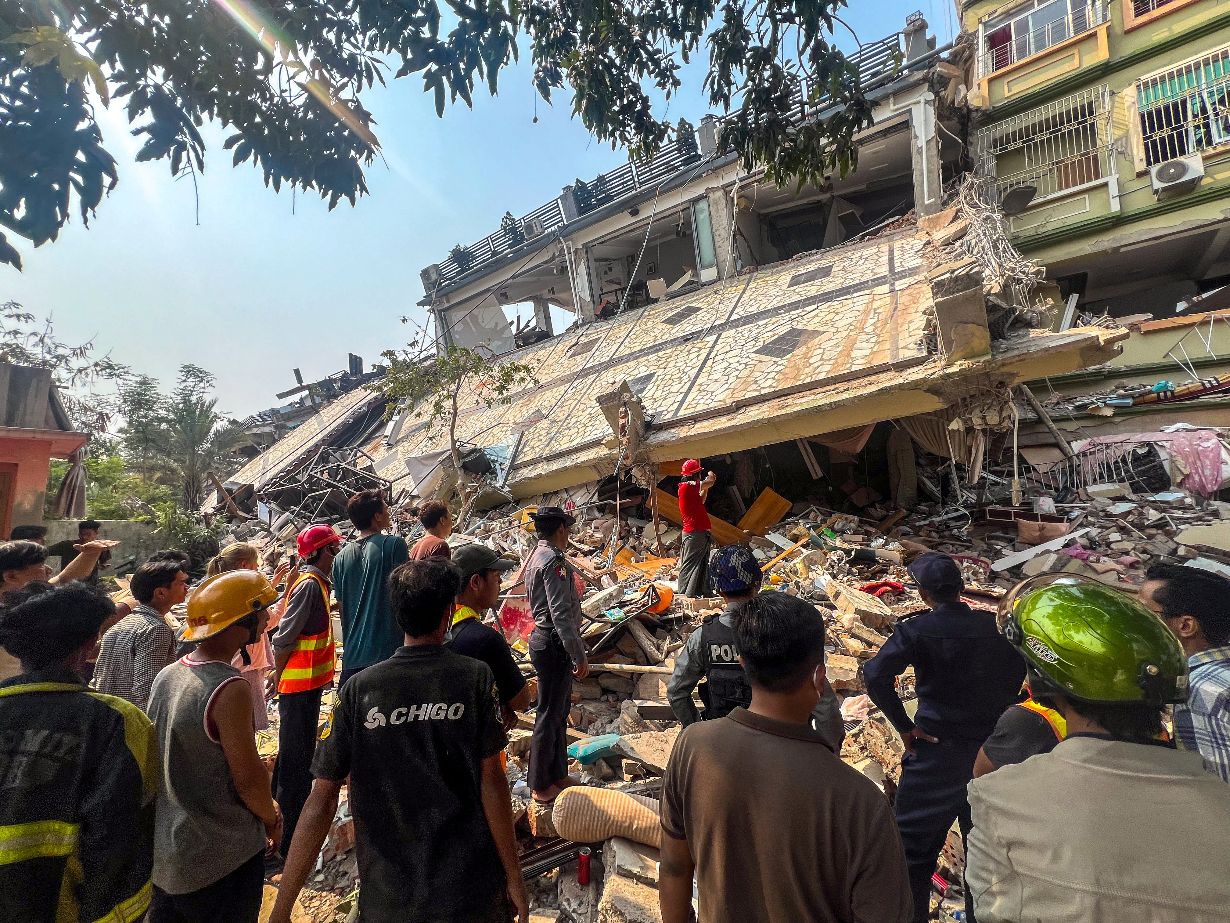Rescue personnel work at the site of a building that collapsed, following a strong earthquake, in Mandalay, Myanmar, March 29, 2025. REUTERS/Stringer