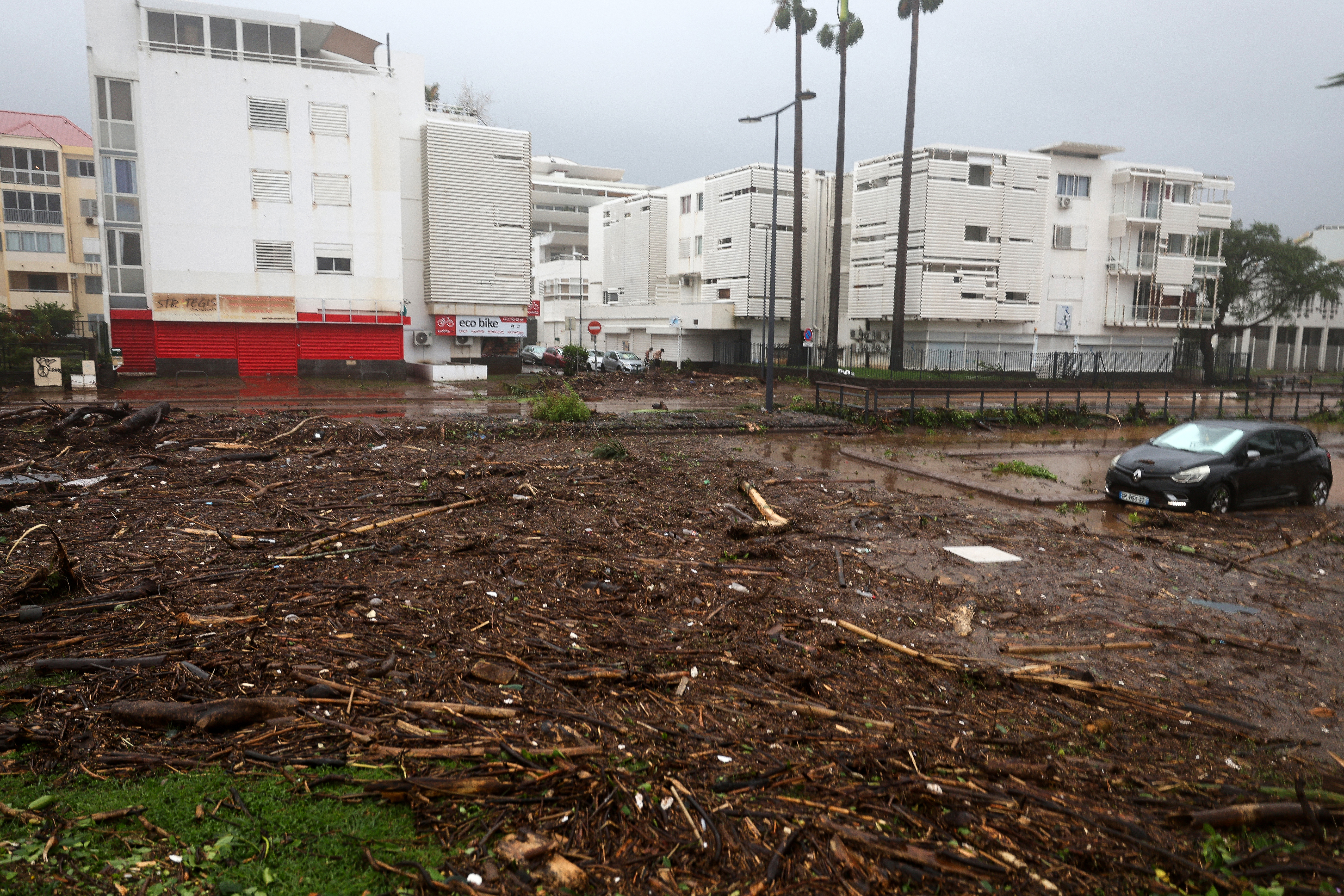 This photograph shows a damaged street following the cyclone Garance in Saint-Denis de la Reunion on the French overseas Indian Ocean island of La Reunion on February 28, 2025. Three people died on February 28, 2025 