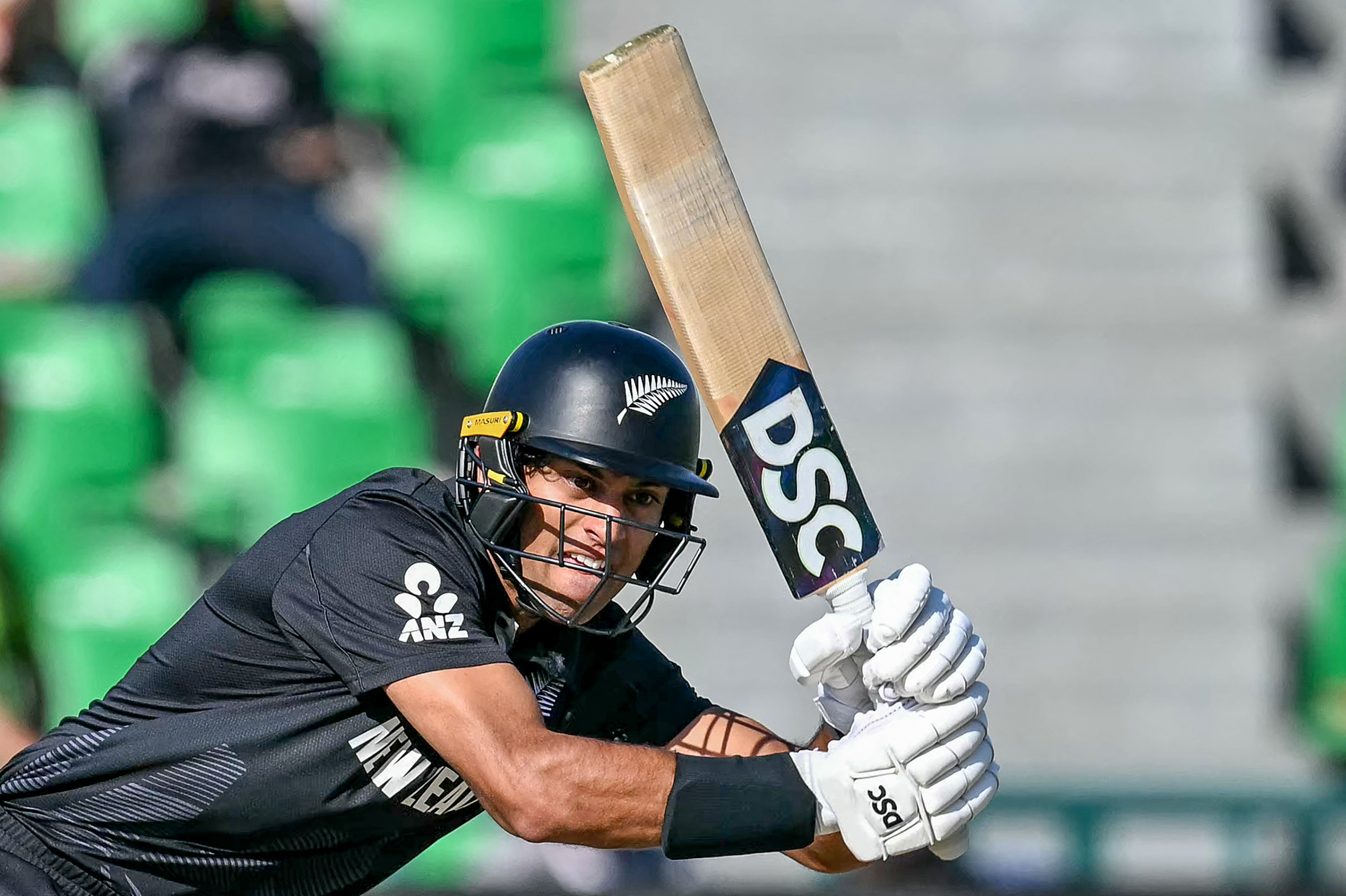 New Zealand's Rachin Ravindra plays a shot during the ICC Champions Trophy one-day international (ODI) semi-final cricket match between New Zealand and South Africa at the Gaddafi Stadium in Lahore on March 5, 2025. (Photo by Aamir QURESHI / AFP)