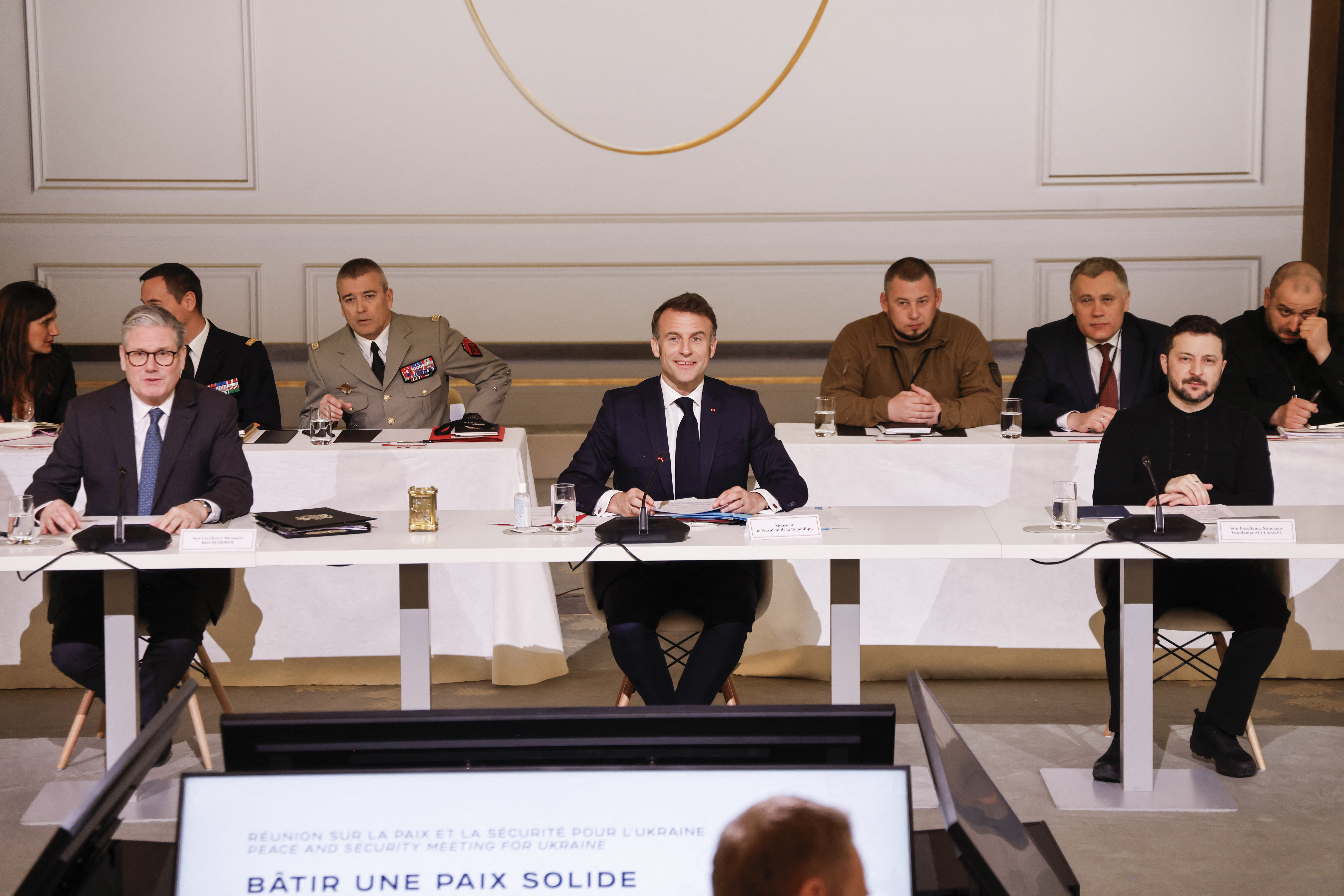 Britain's Prime Minister Keir Starmer, France's President Emmanuel Macron and Ukraine's President Volodymyr Zelensky participate to a meeting on the sidelines of a summit for "coalition of the willing" at the Elysee Palace, in Paris, on March 27, 2025.