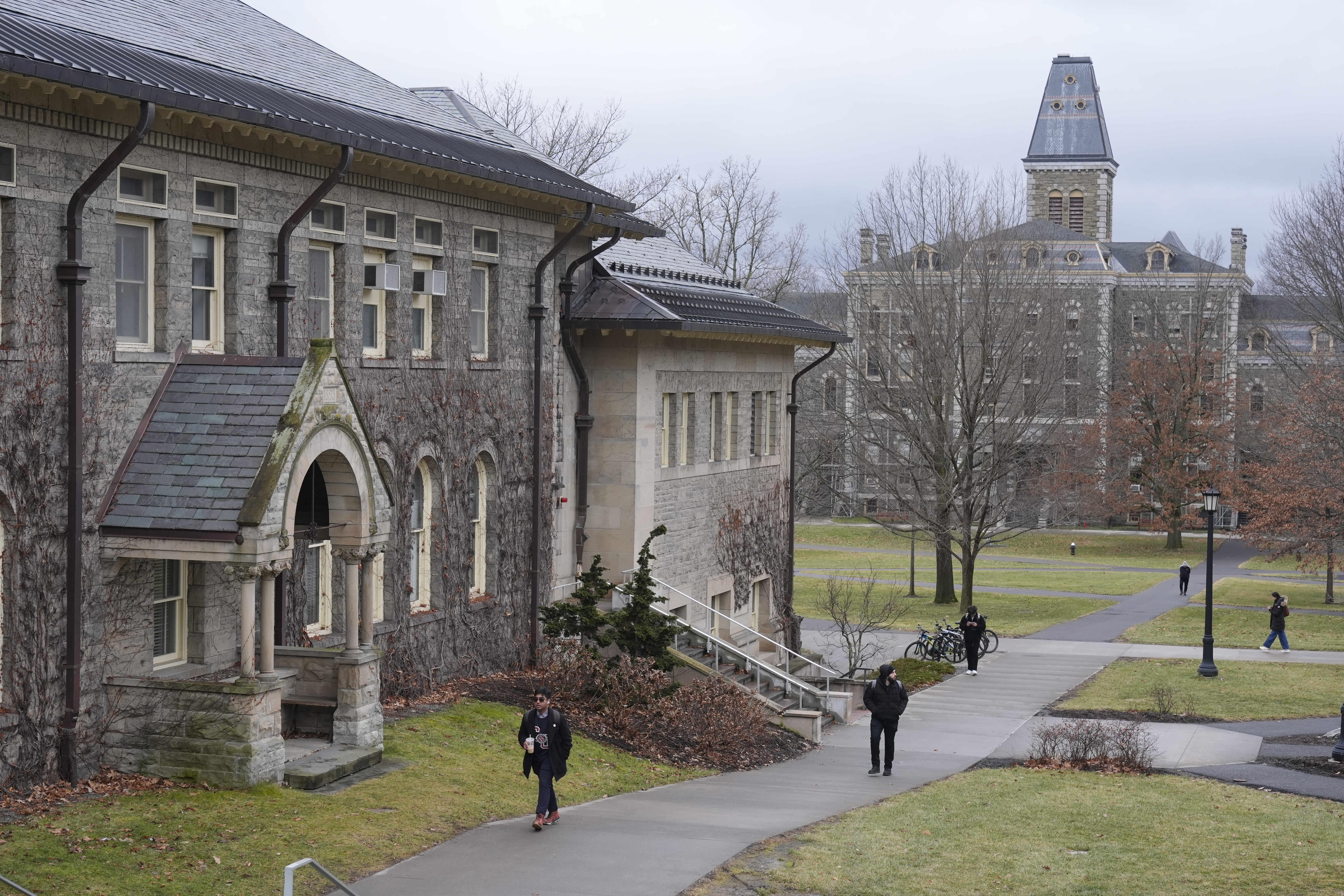 People walk on the campus of Cornell University in Ithaca, N.Y., Friday, Feb. 2, 2024. (AP Photo/Seth Wenig)