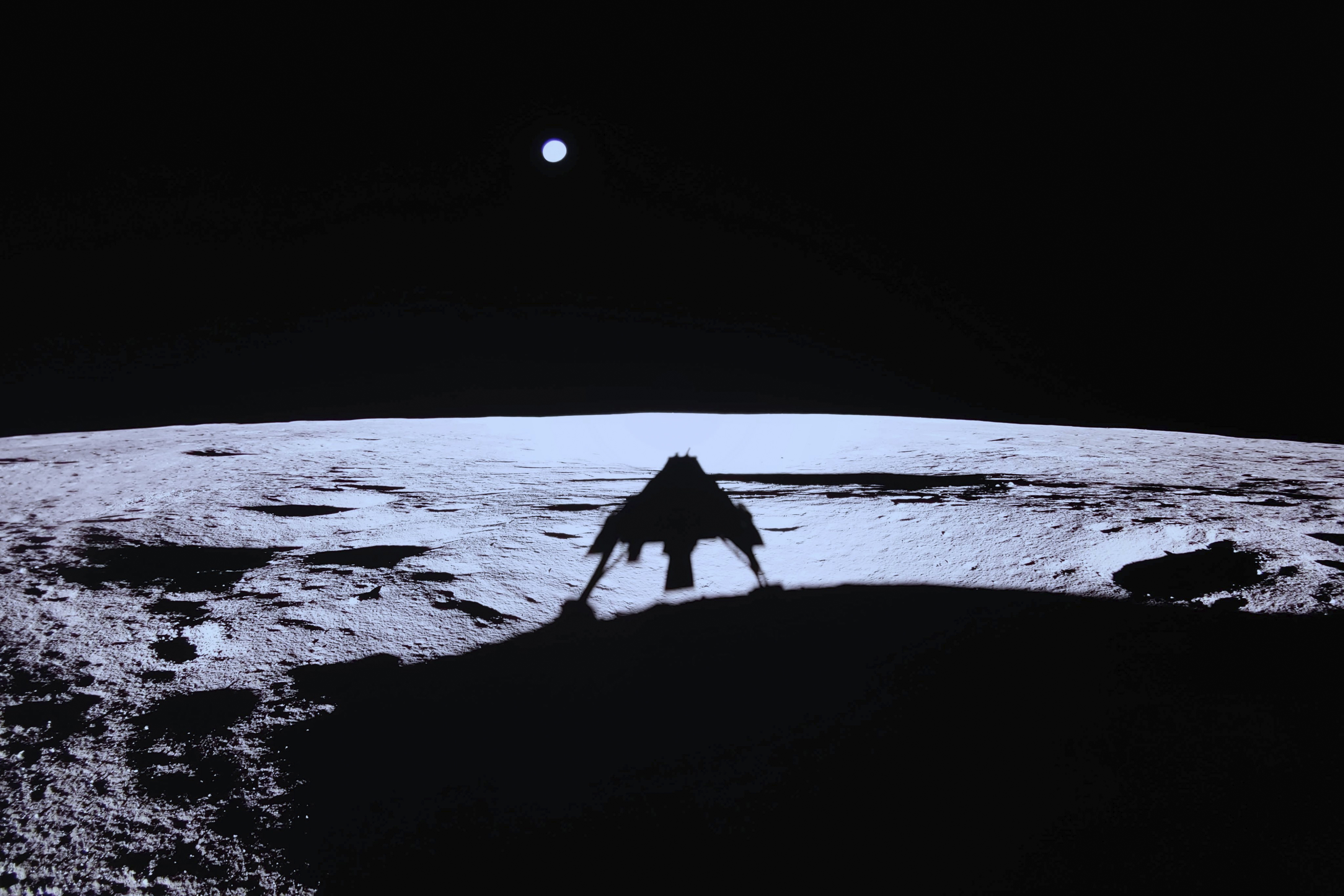 Private lunar lander Blue Ghost's shadow is seen on the moon's surface after touching down