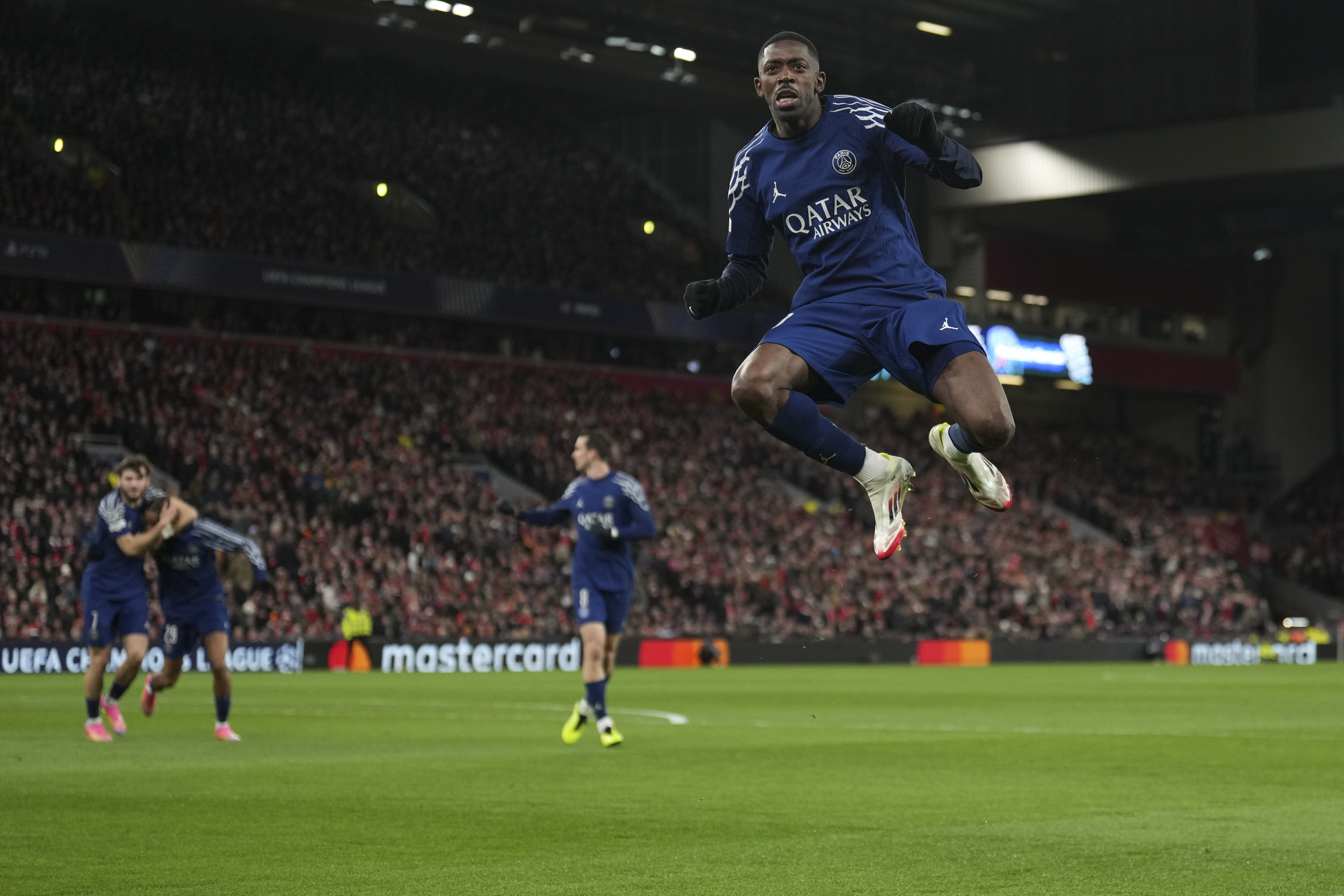 PSG's Ousmane Dembele celebrates after scoring during the Champions League round of 16 second leg soccer match between Liverpool and Paris Saint-Germain at Anfield in Liverpool, England, Tuesday, March 11, 2025. (AP Photo/Jon Super)
