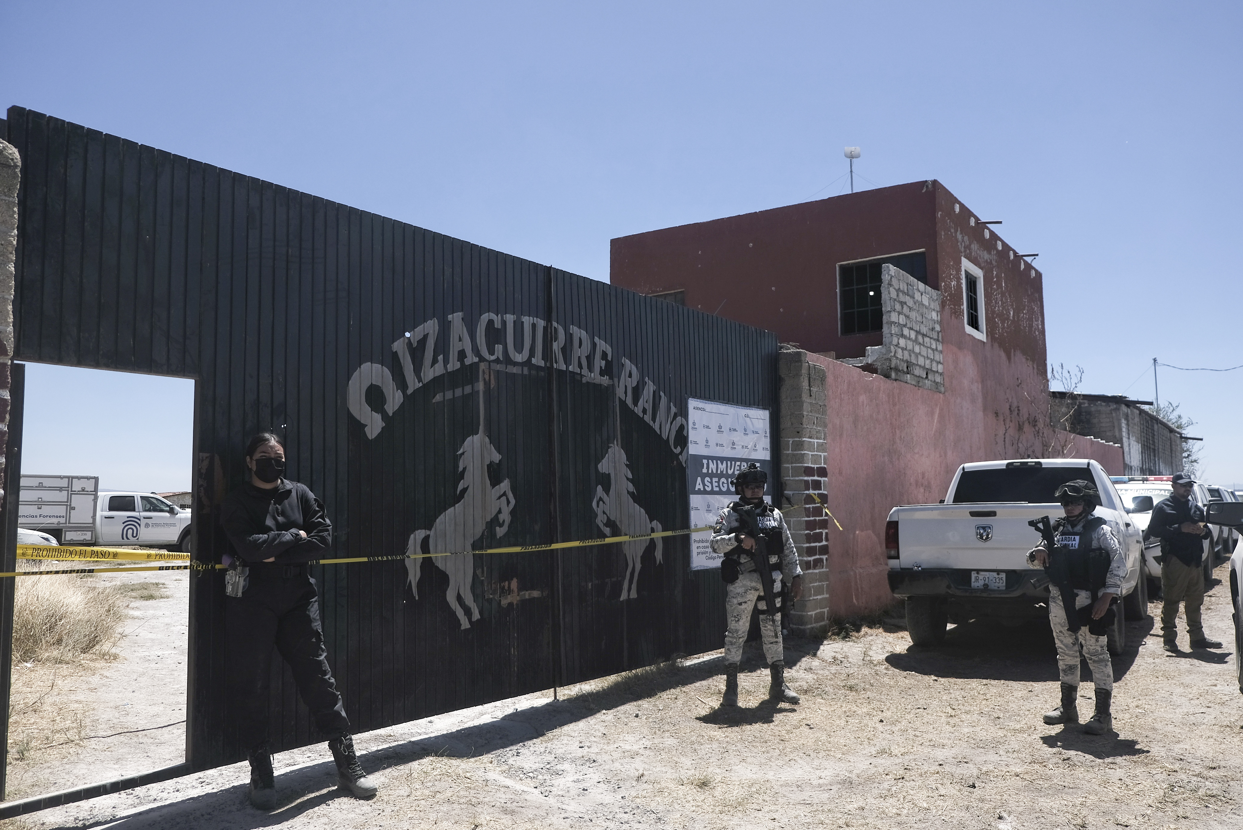 The exterior of the Teuchitlán ranch, where police stand guard