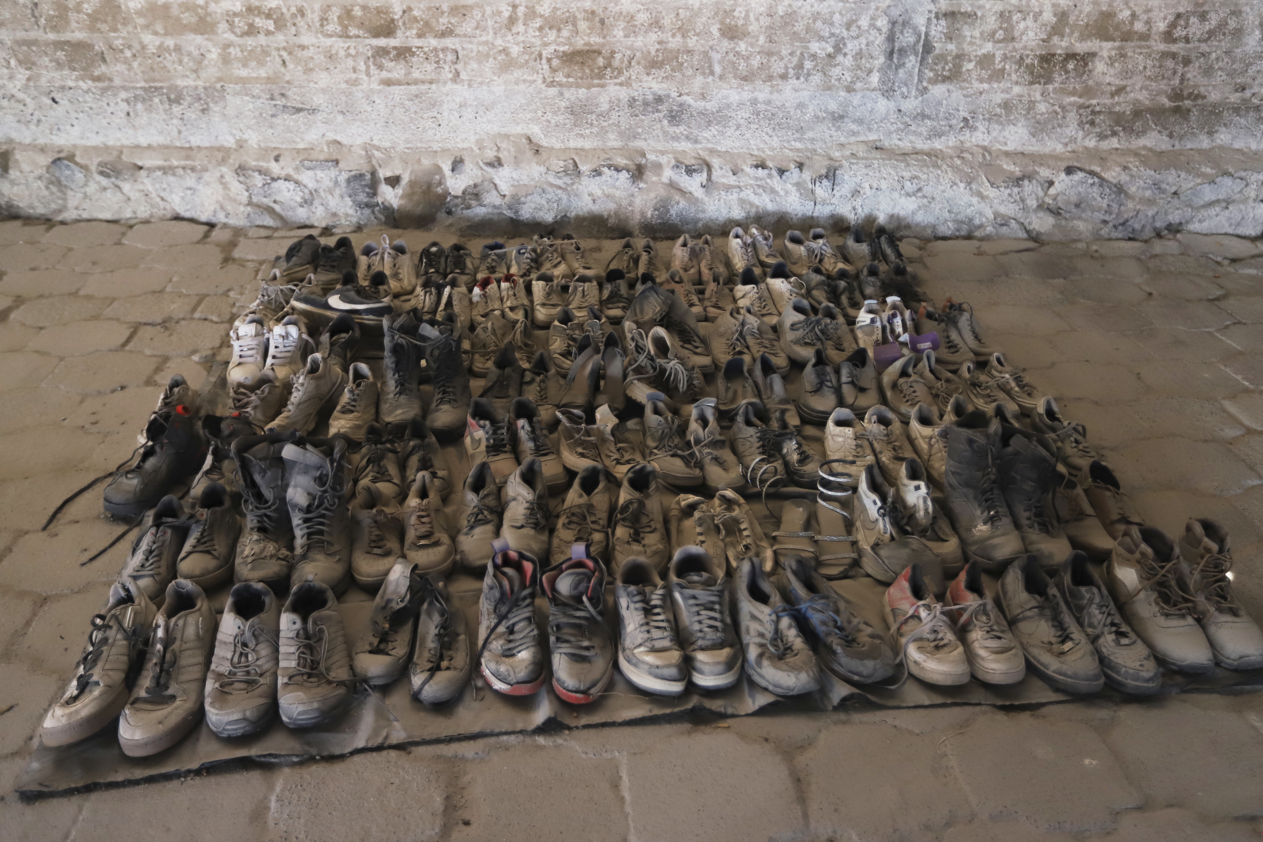 Dusty shoes recovered from the Jalisco ranch mass grave