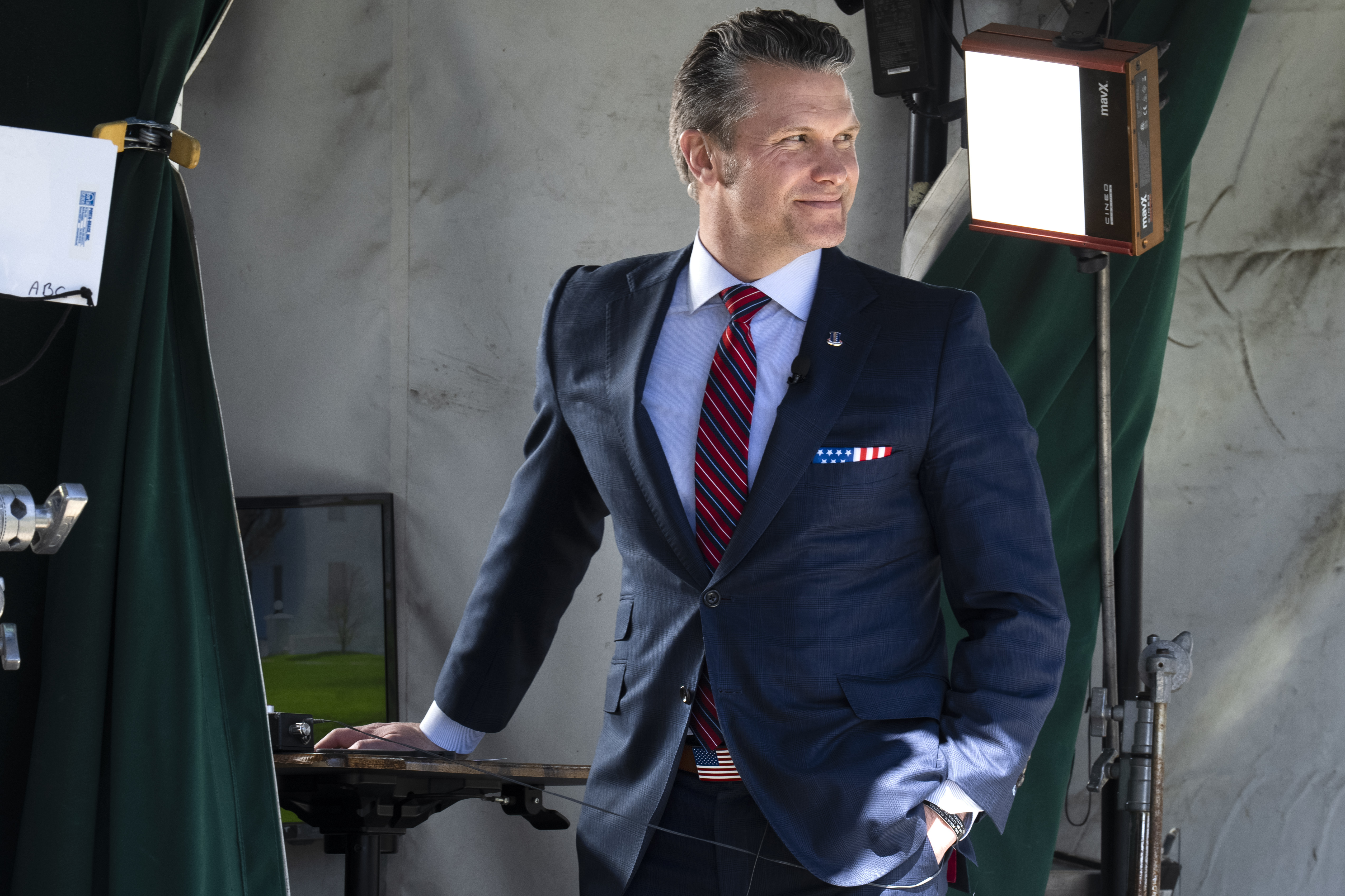 Pete Hegseth in front of lights for a camera shoot