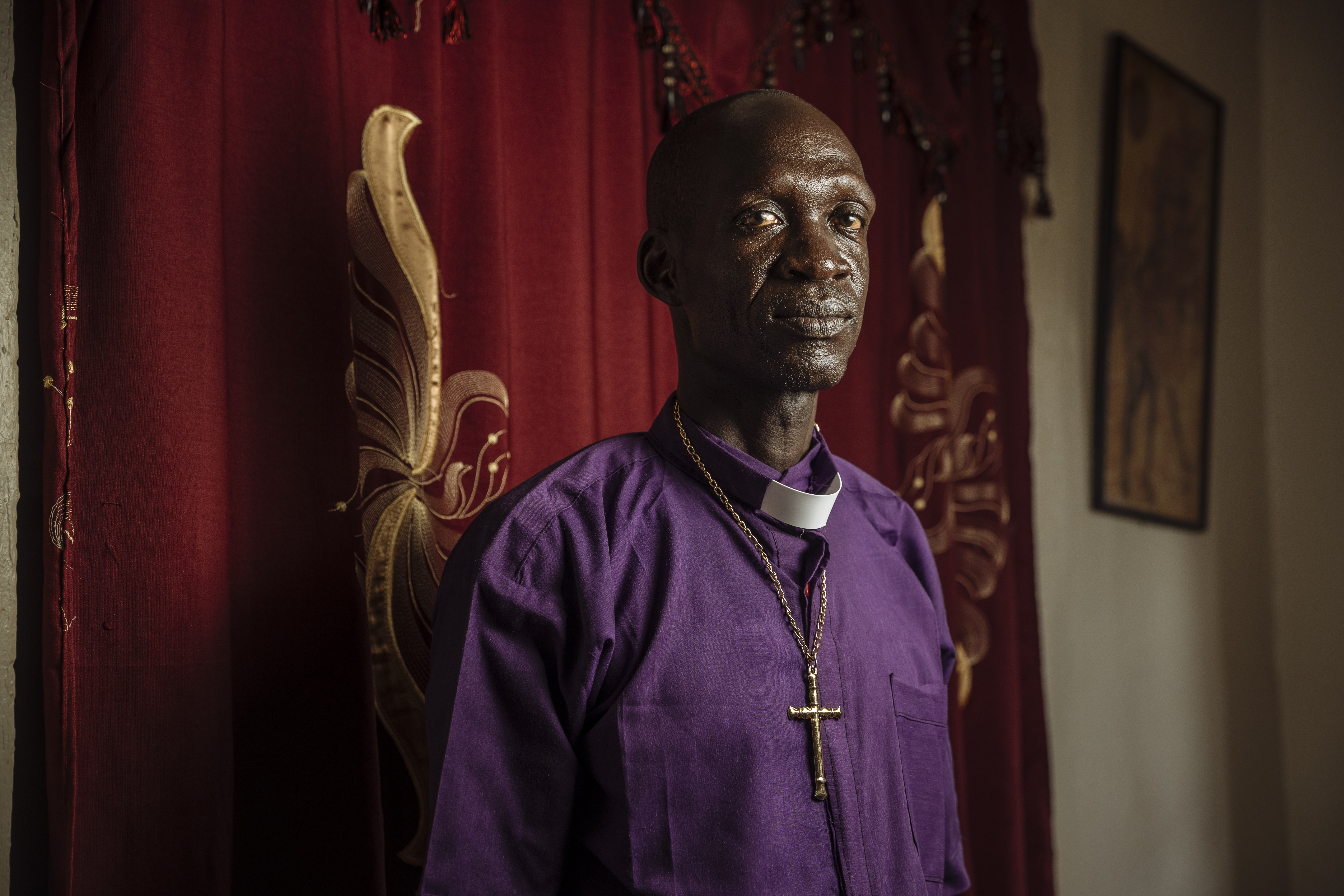 Reverend Levi, Bishop of the Episcopal Diocese in Yei, has led peace efforts in a region scarred by conflict. Through dialogue and church-supported initiatives, he has worked to heal the rift between civilians and soldiers, fostering trust and reconciliation. Muse Mohammed/IOM