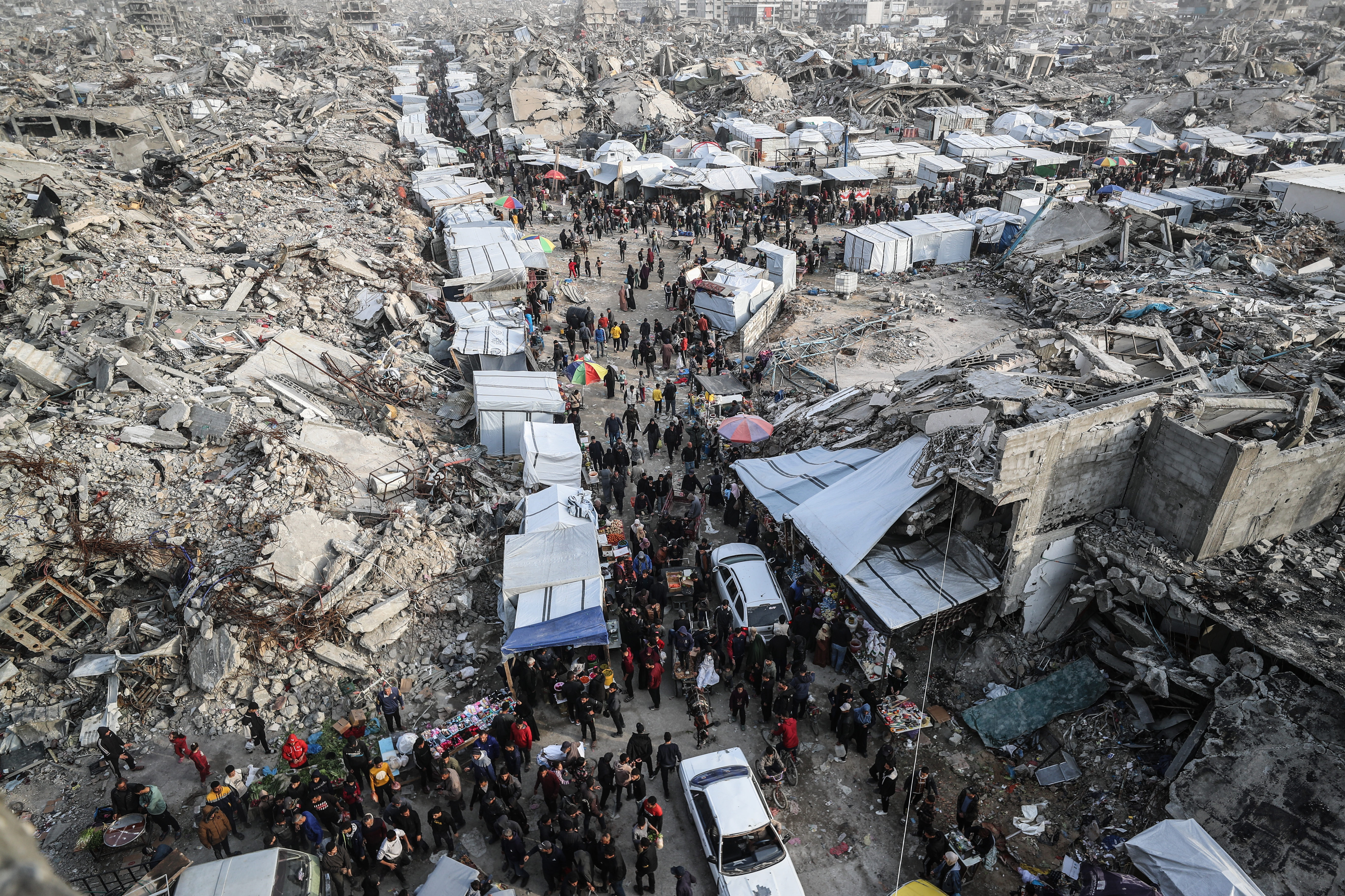 An aerial view of Palestinians shopping at a market