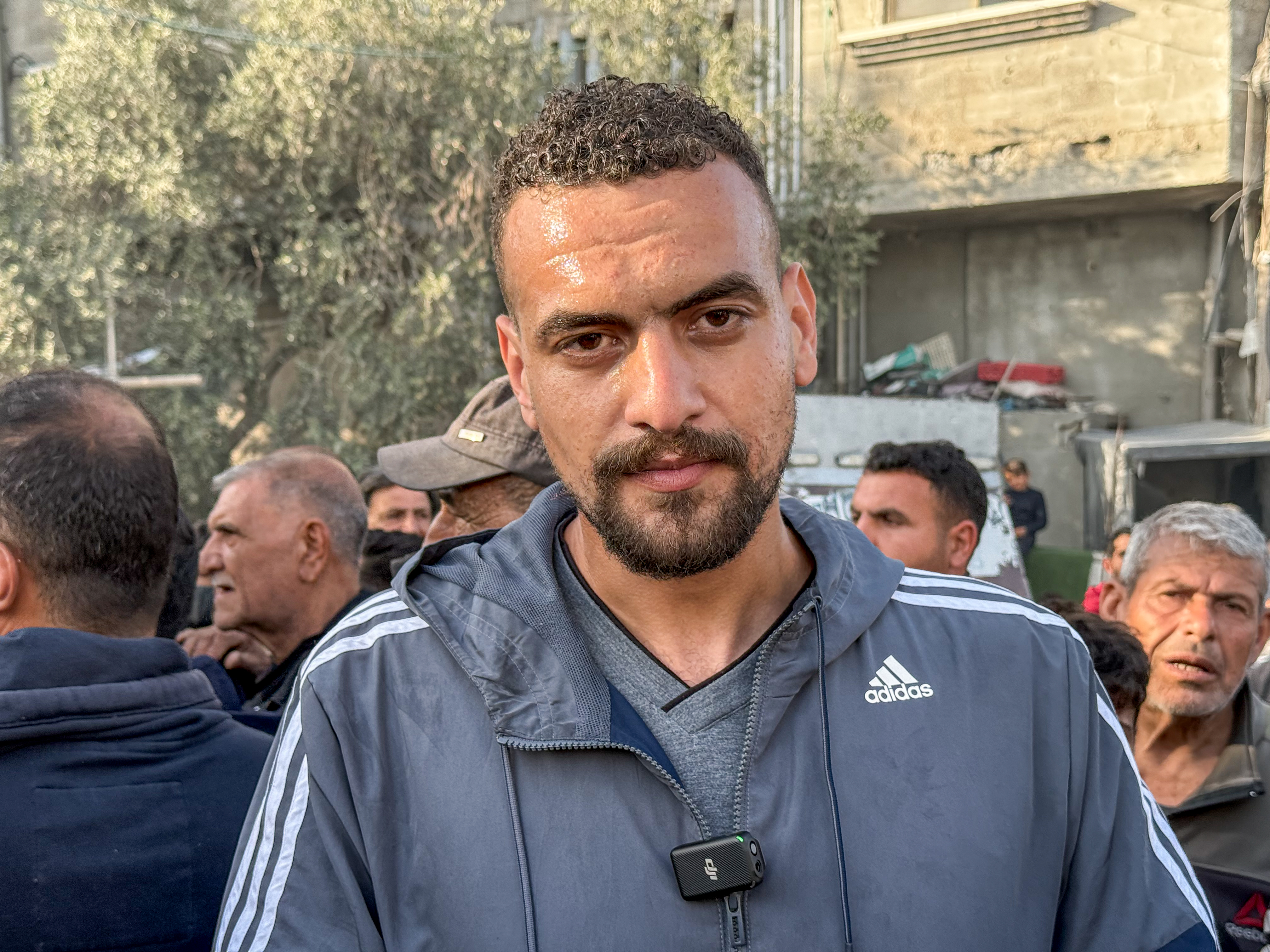 Mahmoud Jihad Al-Haj Ahmed, 34, a doctor at Kamal Adwan Hospital, in a grey sweater