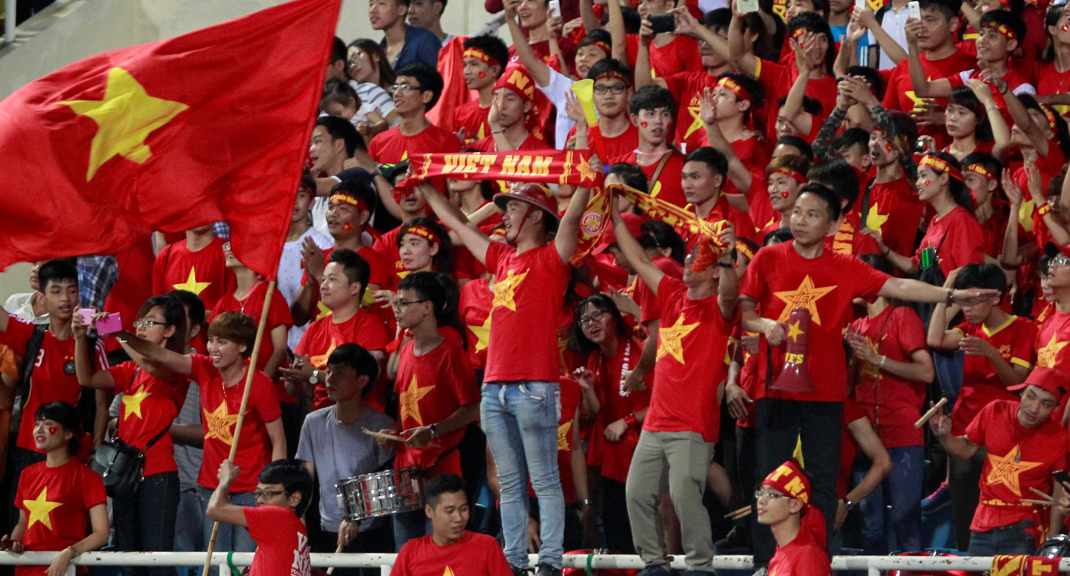 Football Soccer - Vietnam v Syria - International Friendly - My Dinh Stadium, Hanoi, Vietnam - 31/5/16. Vietnamese soccer fans celebrate the winning against Syria. REUTERS/Kham