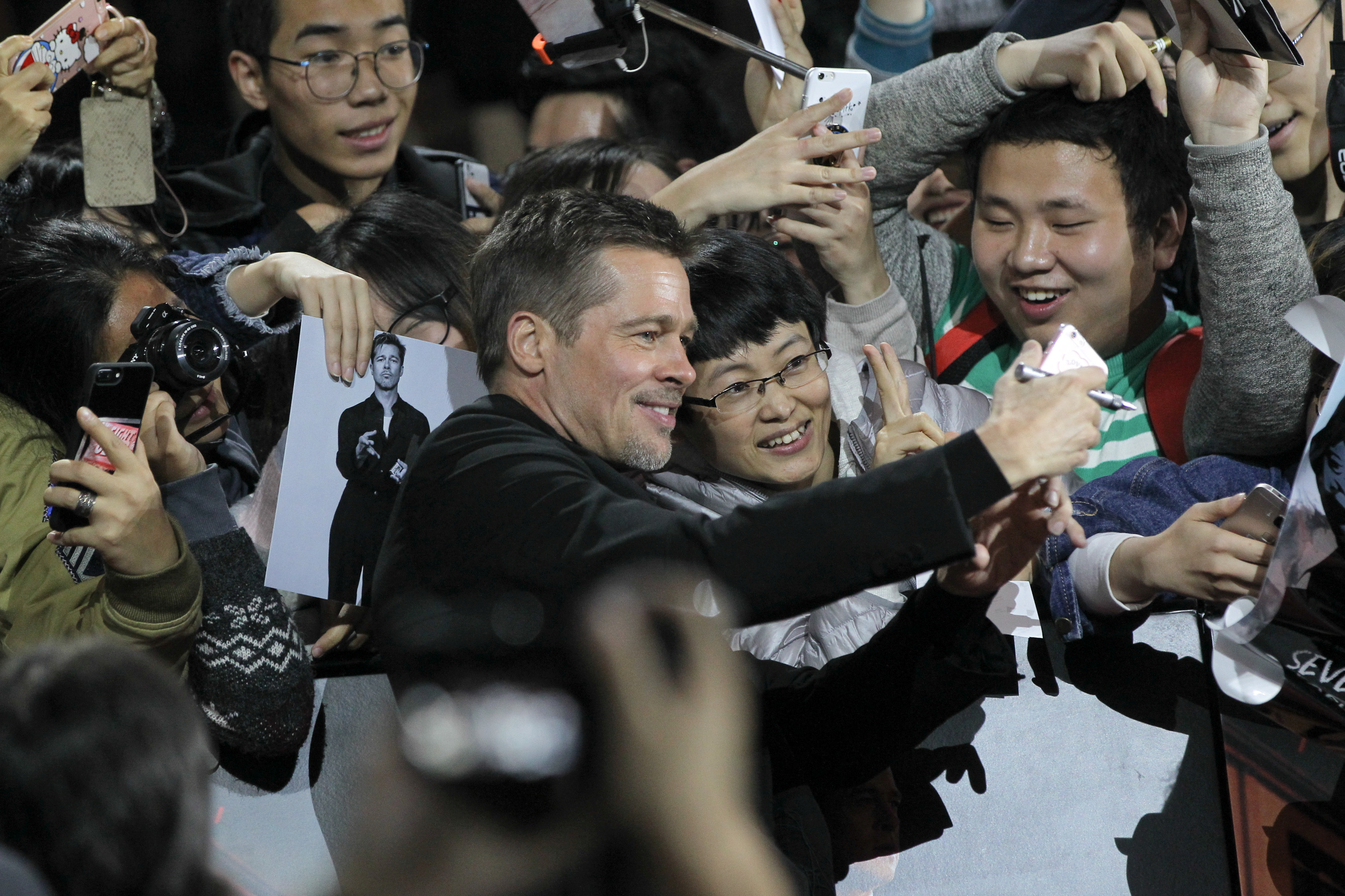 Actor Brad Pitt attends a promotional event for the movie Allied in Shanghai, China, November 14, 2016. REUTERS/Stringer ATTENTION EDITORS - THIS PICTURE WAS PROVIDED BY A THIRD PARTY. EDITORIAL USE ONLY. CHINA OUT. NO COMMERCIAL OR EDITORIAL SALES IN CHINA. TPX IMAGES OF THE DAY