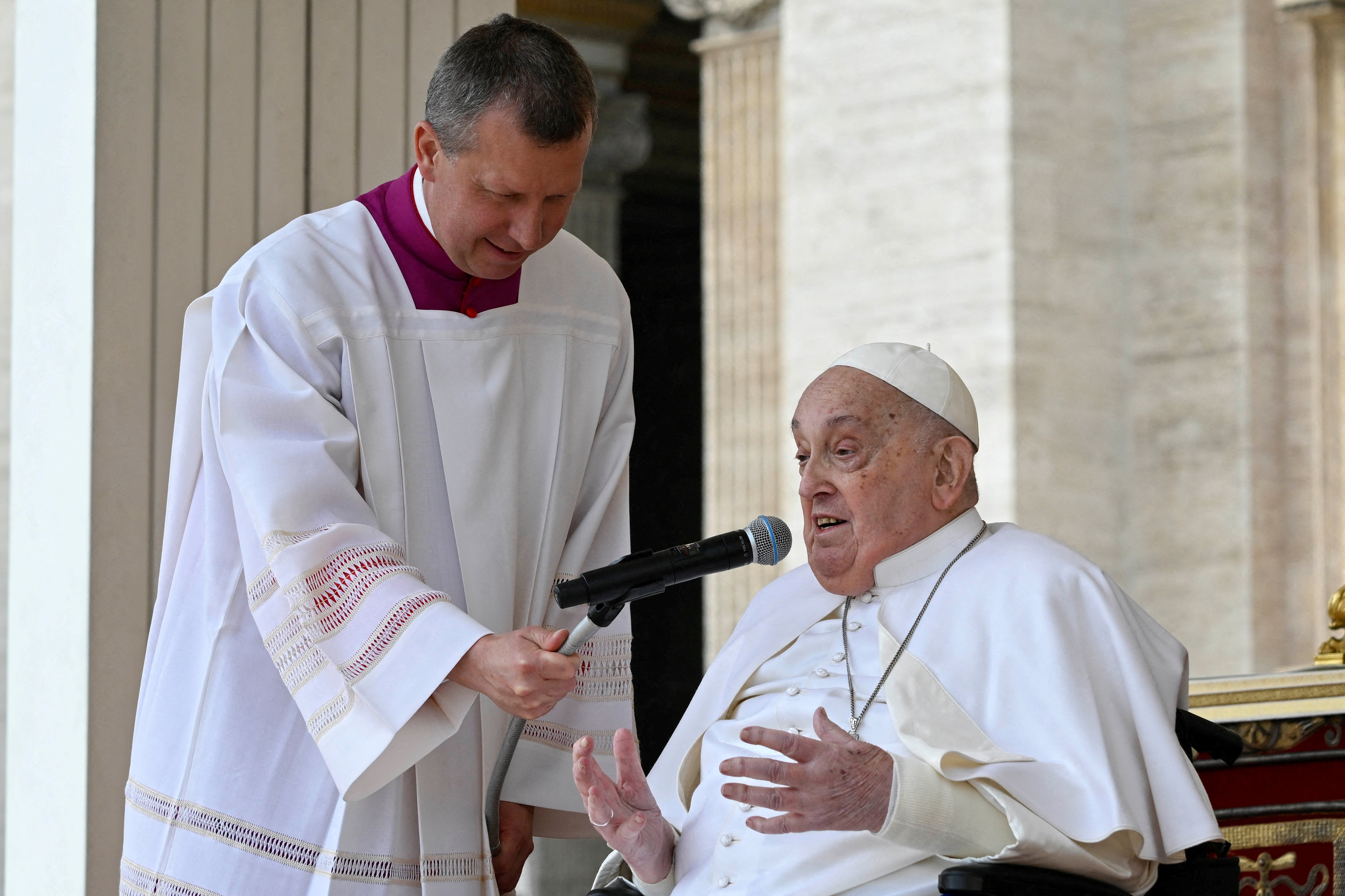 Pope Francis speaks as he unexpectedly appears during the Palm Sunday Mass