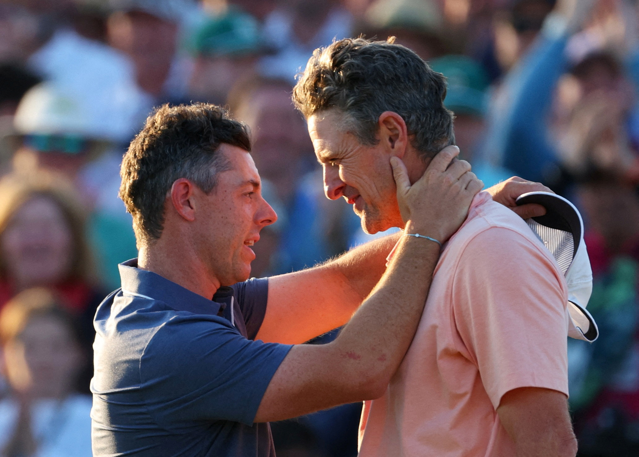 Rory McIlroy and Justin Rose react.