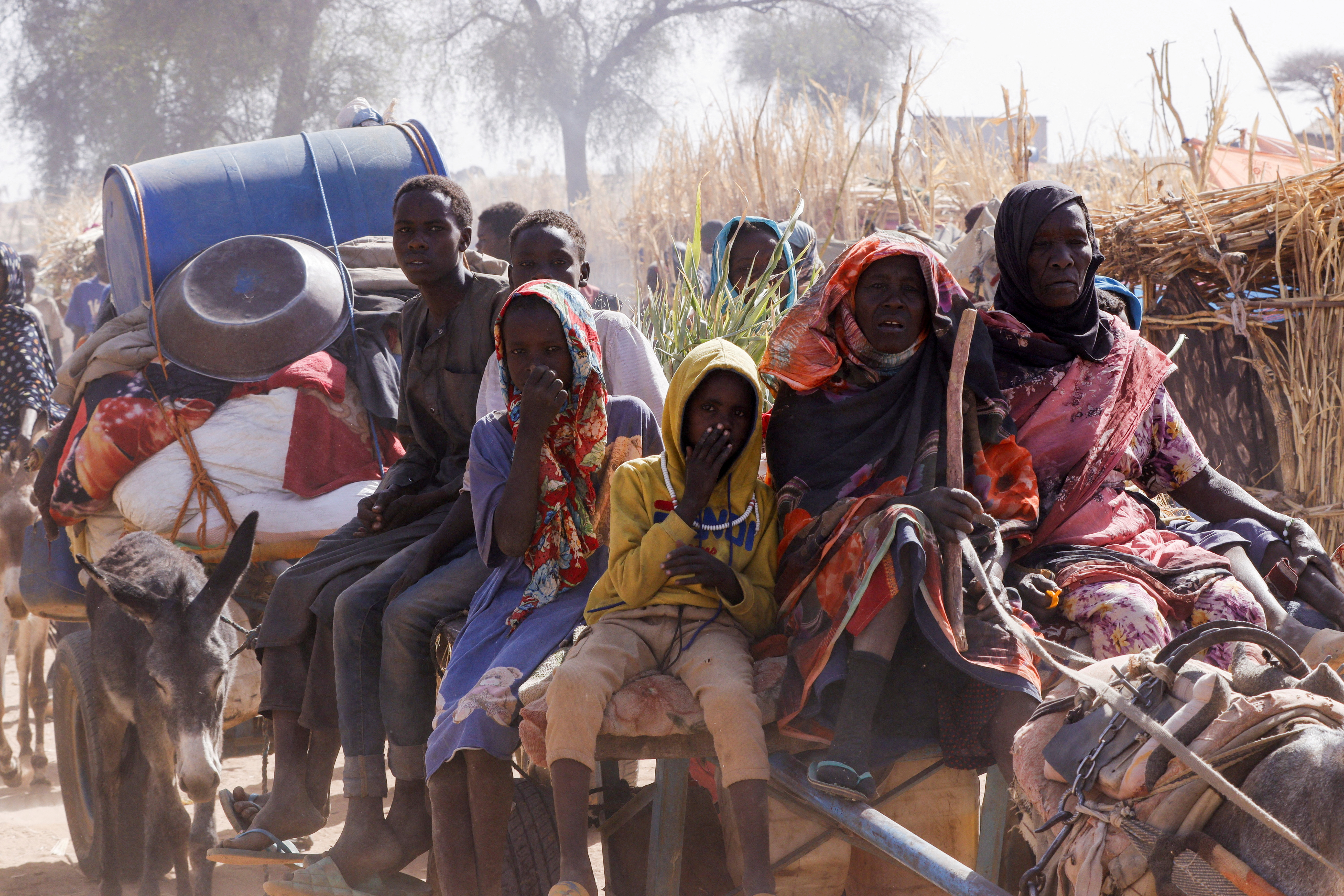 Displaced people ride a an animal-drawn cart, following Rapid Support Forces (RSF) attacks on Zamzam displacement camp, in the town of Tawila, North Darfur, Sudan April 15, 2025. REUTERS/Stringer TPX IMAGES OF THE DAY