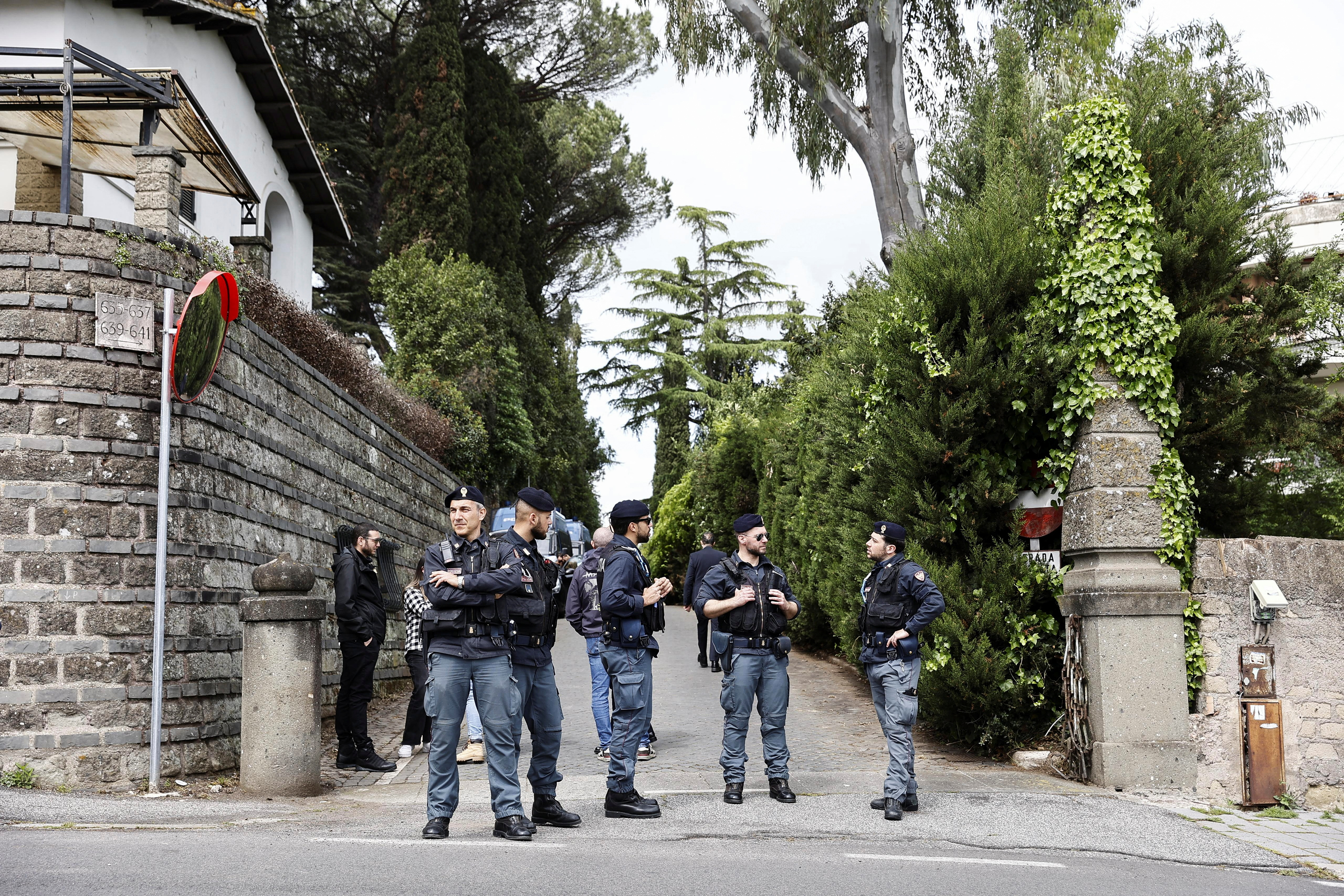 Police members stand at one of the entrances of the Omani embassy, where the second round of US-Iran talks is taking place, in Rome, Italy, April 19, 2025. REUTERS/Vincenzo Livieri
