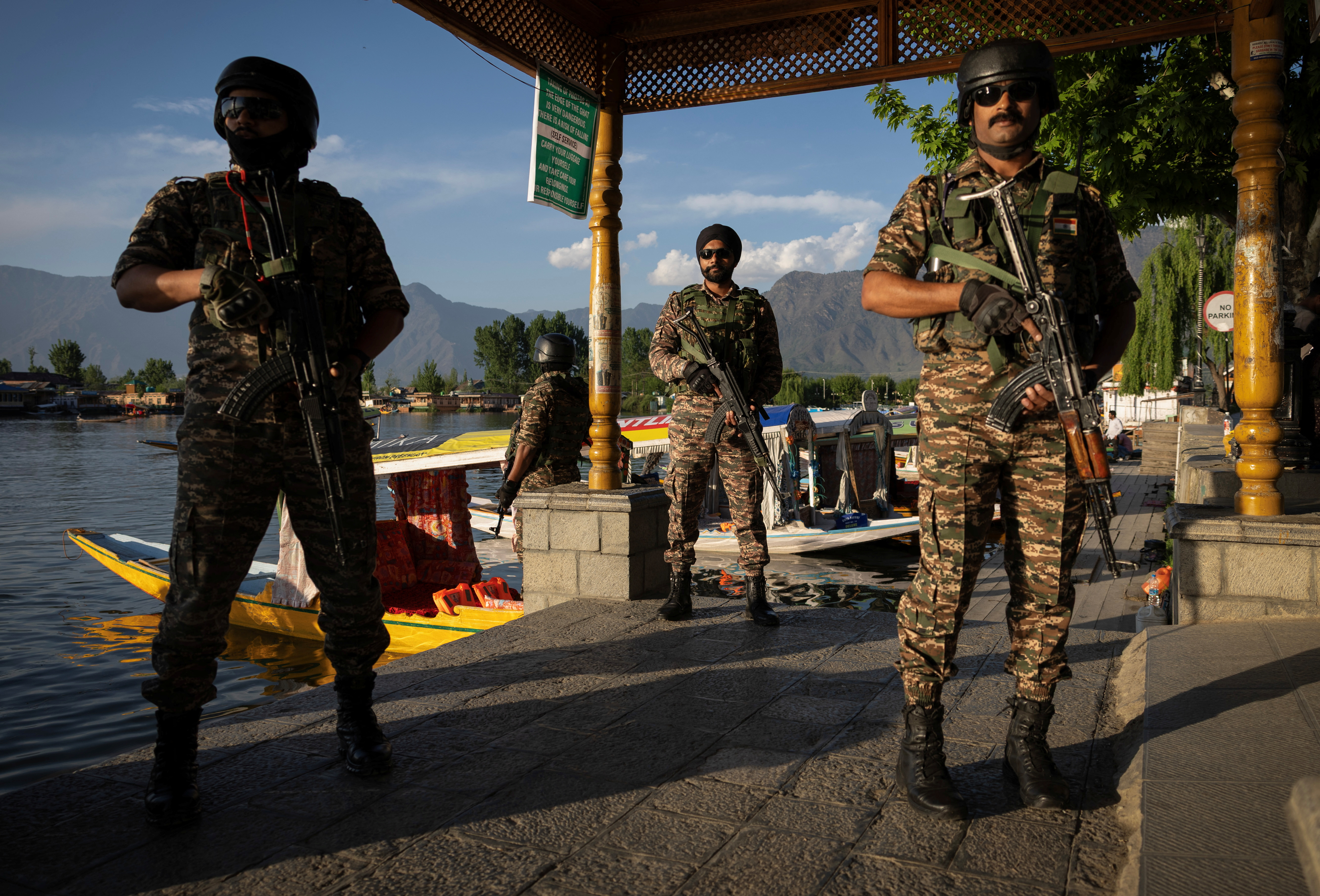 Indian security force personnel stand guard on the banks of Dal Lake, following a suspected militant attack near south Kashmir's Pahalgam, in Srinagar April 25, 2025. [Adnan Abidi/Reuters]