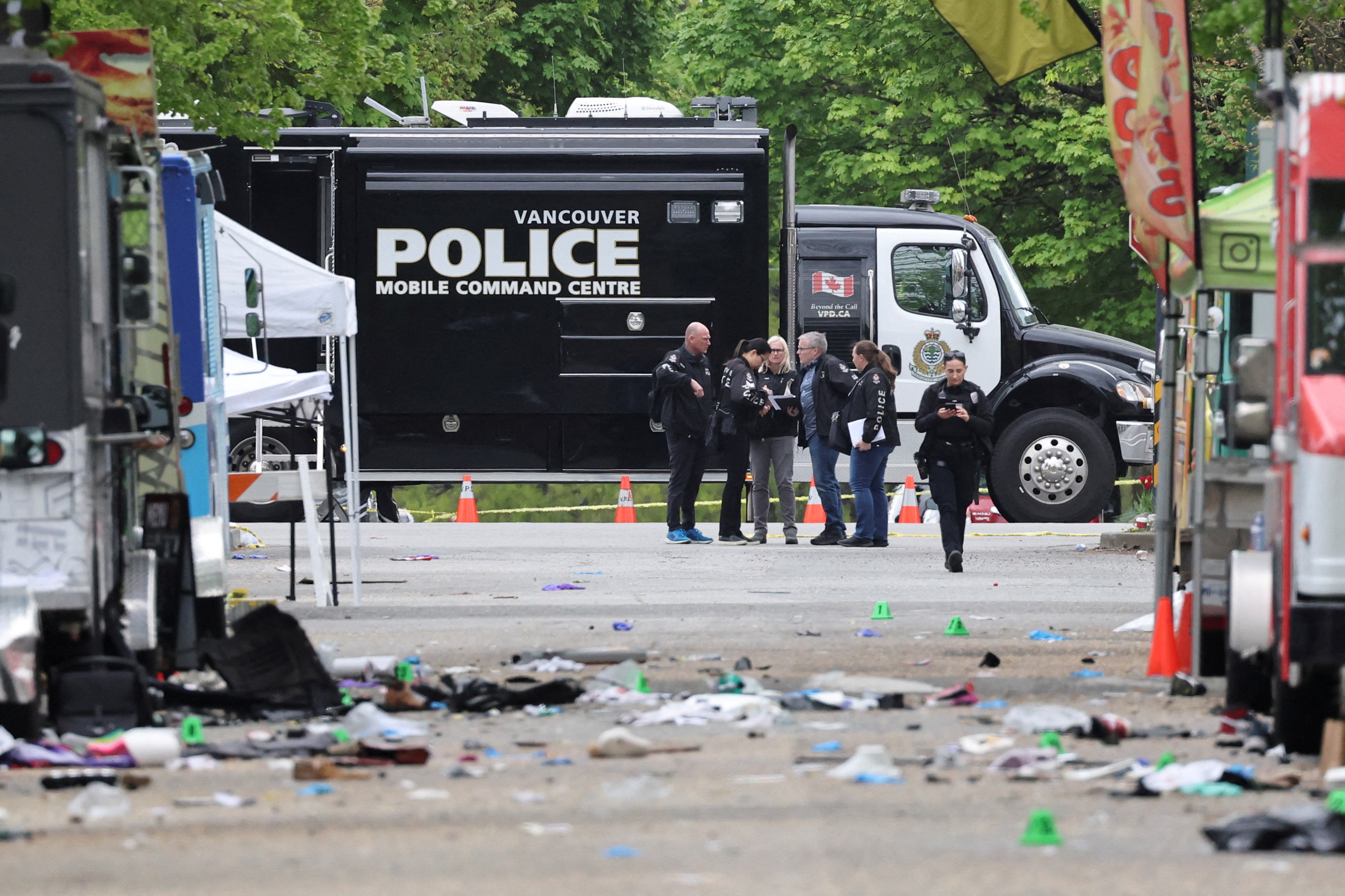 Police officers work at the scene, the morning after a vehicle was driven into a crowd at a Filipino community Lapu Lapu Day block party, in Vancouver, British Columbia, Canada April 27, 2025. REUTERS/Chris Helgren TPX IMAGES OF THE DAY