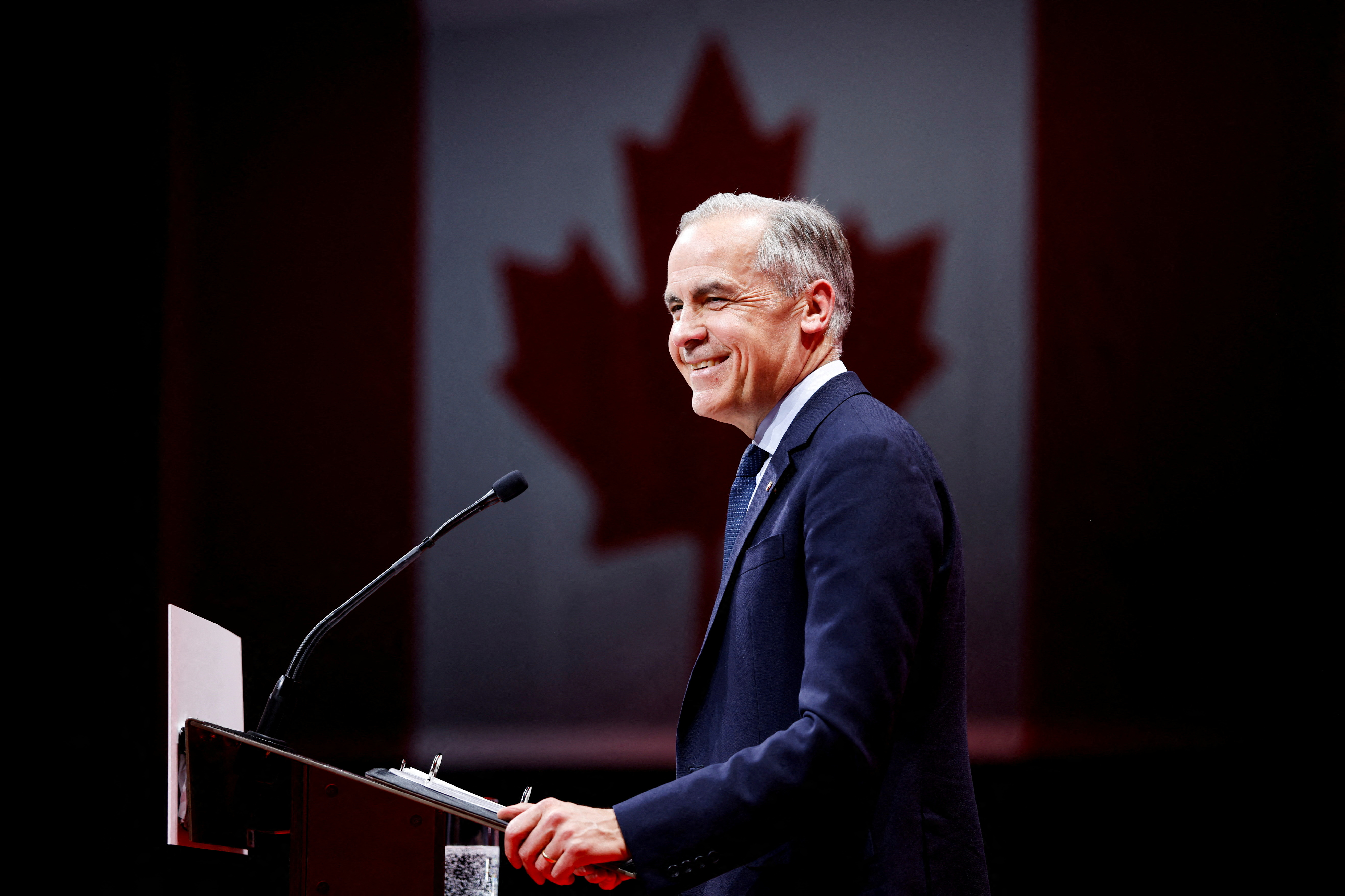 Canada's Prime Minister Mark Carney speaks at a podium.
