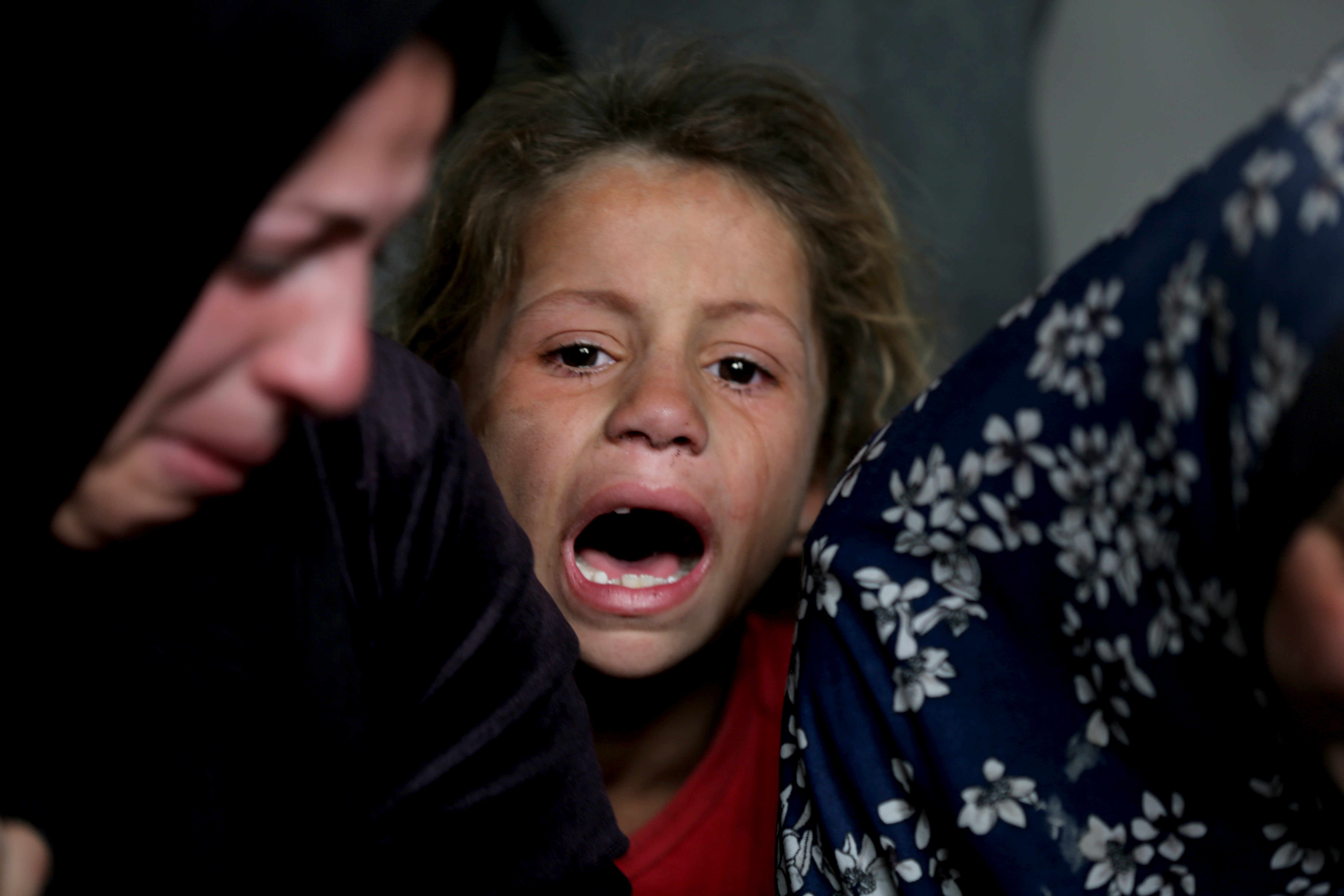 GAZA CITY, GAZA - APRIL 3: Relatives of Palestinians who lost their lives after Israeli attack mourn in Gaza City, Gaza on April 3, 2025. It was reported that there were casualties and wounded as a result of the Israeli army's attack on the Shujaiyya neighborhood east of Gaza City. The bodies of those who lost their lives as a result of the attack were taken by their relatives from the morgue of Al Ahli (Baptist) Hospital in the city for funeral prayers and burial. ( Mahmoud İssa - Anadolu Agency )