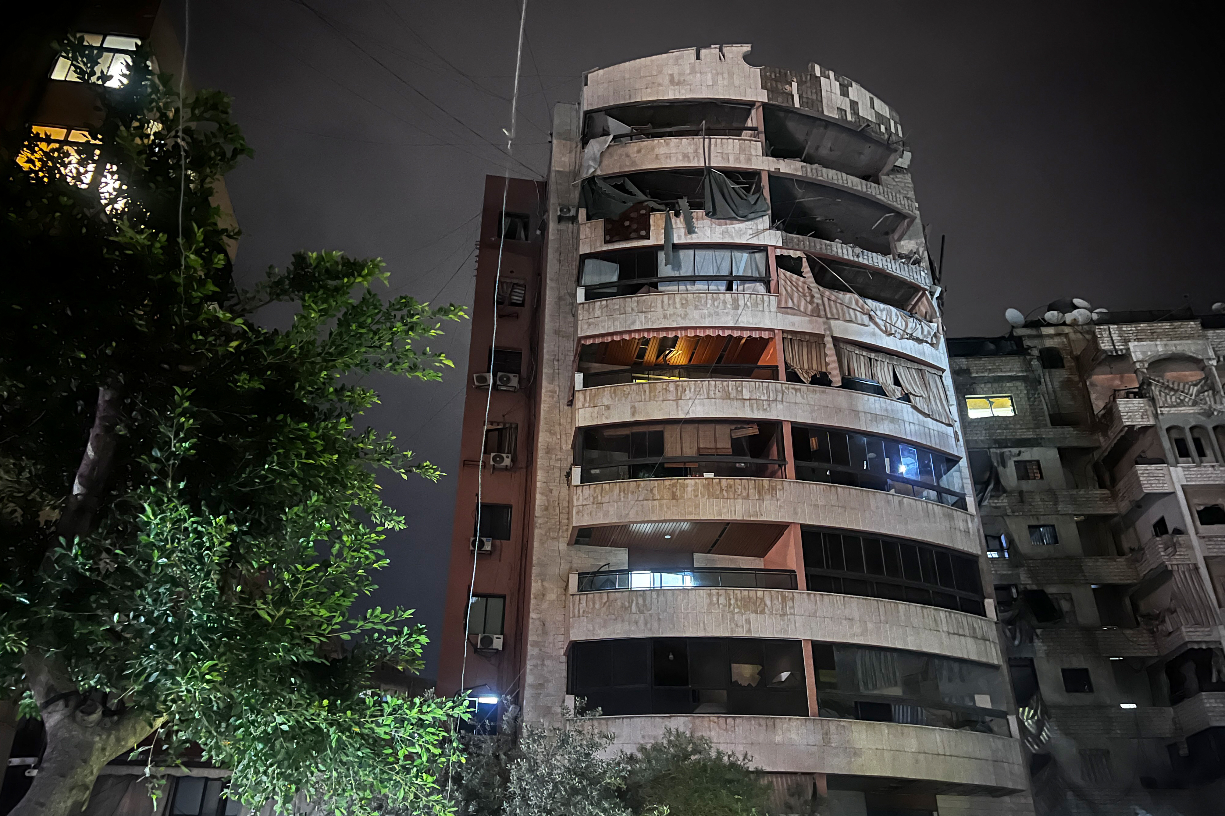 This picture taken early on April 1, 2025 shows a damaged building after an Israeli strike in southern Beirut. Israel's military said it carried out a strike on a southern suburb of the Lebanese capital Beirut targeting a Hezbollah operative, the second such strike since a November ceasefire. (Photo by Ibrahim AMRO / AFP)