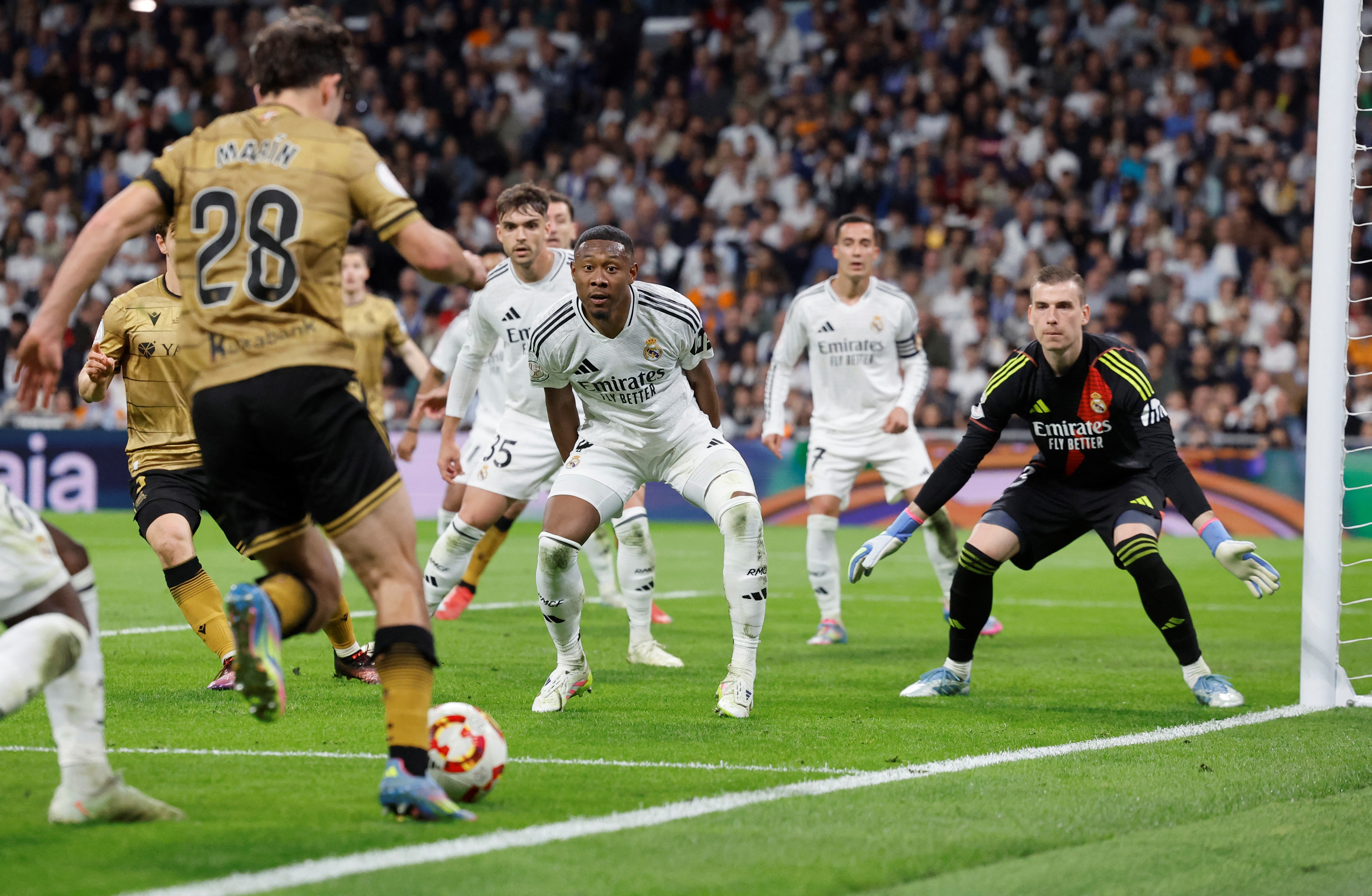 Real Madrid's Austrian defender #04 David Alaba is pictured before his own goal during the Spanish Copa del Rey (King's Cup) semi-final second leg football match between Real Madrid CF and Real Sociedad at the Santiago Bernabeu stadium in Madrid on April 1, 2025. (Photo by OSCAR DEL POZO / AFP)